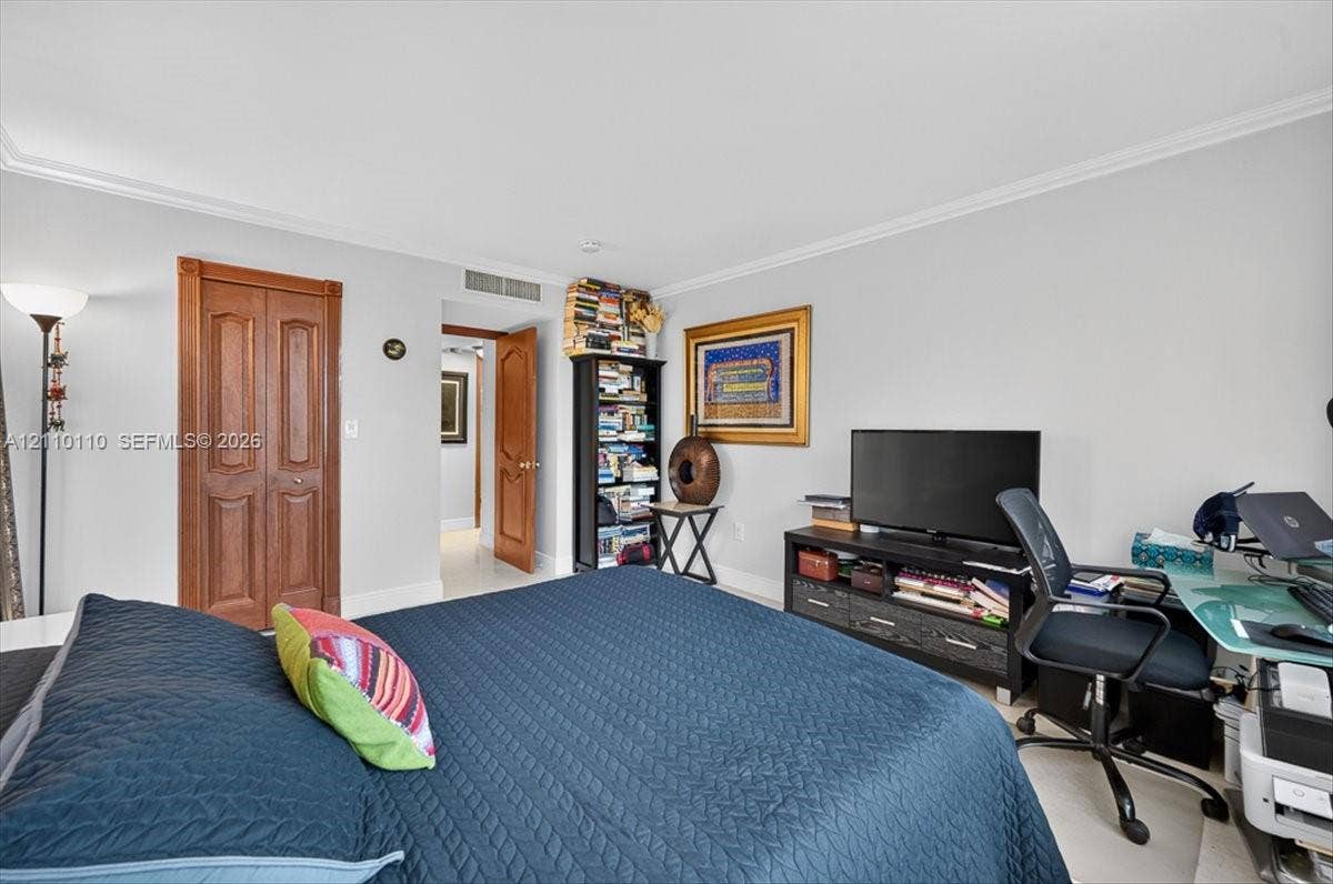 2751 S Ocean Drive, #801N, Hollywood, FL 33019 Neutral wall tones, crown molding, and wood-finish interior doors