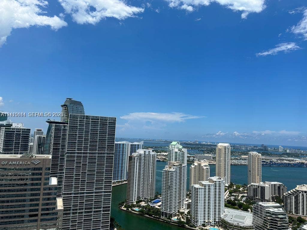 950 Brickell Bay Drive, #5108, Miami, Miami, FL 33131 High-rise perspective featuring expansive urban skyline, coastal waterway, and horizon