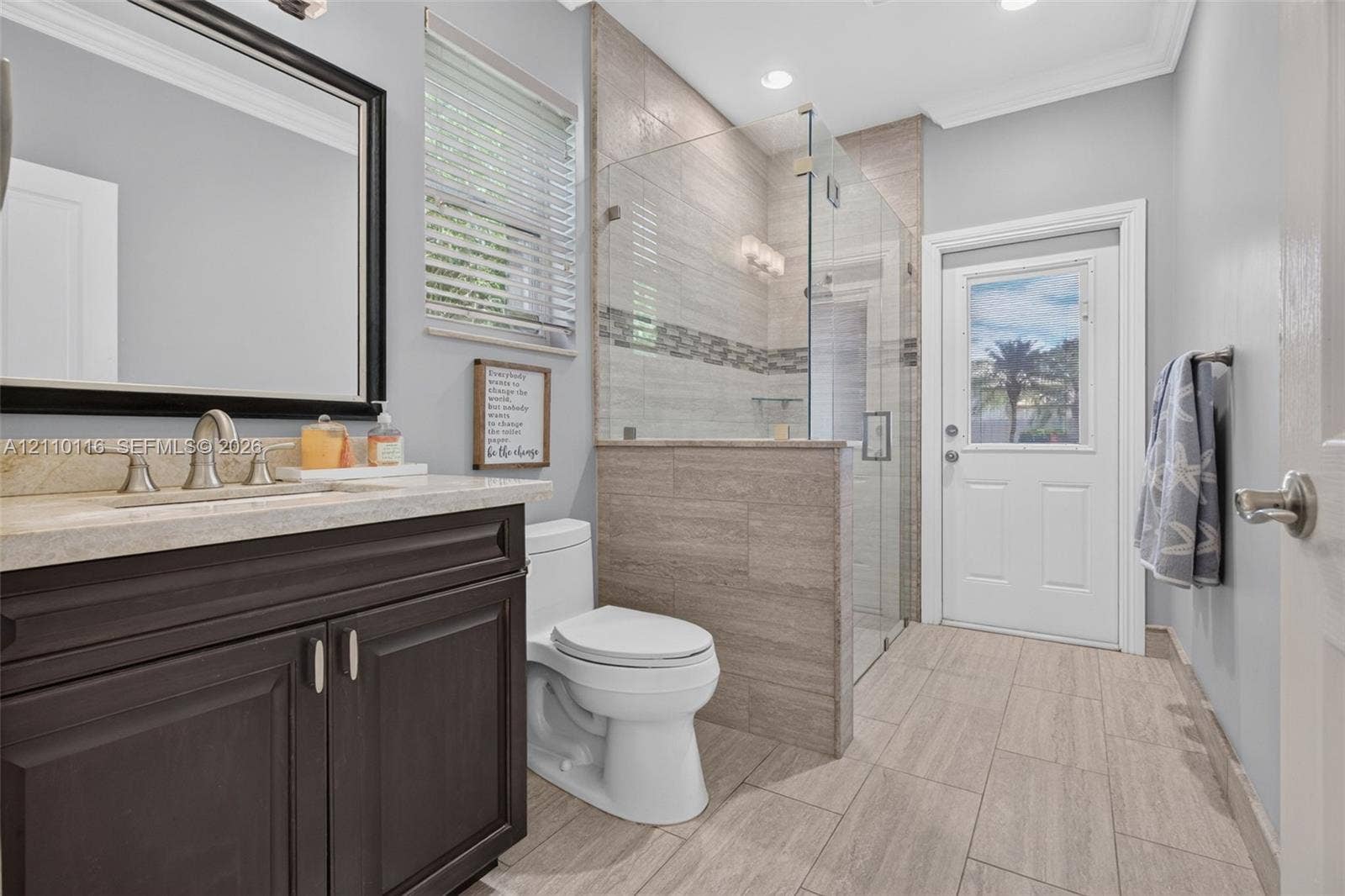 Cabana Bathroom leading to pool & patio; shower enclosure with glass walls