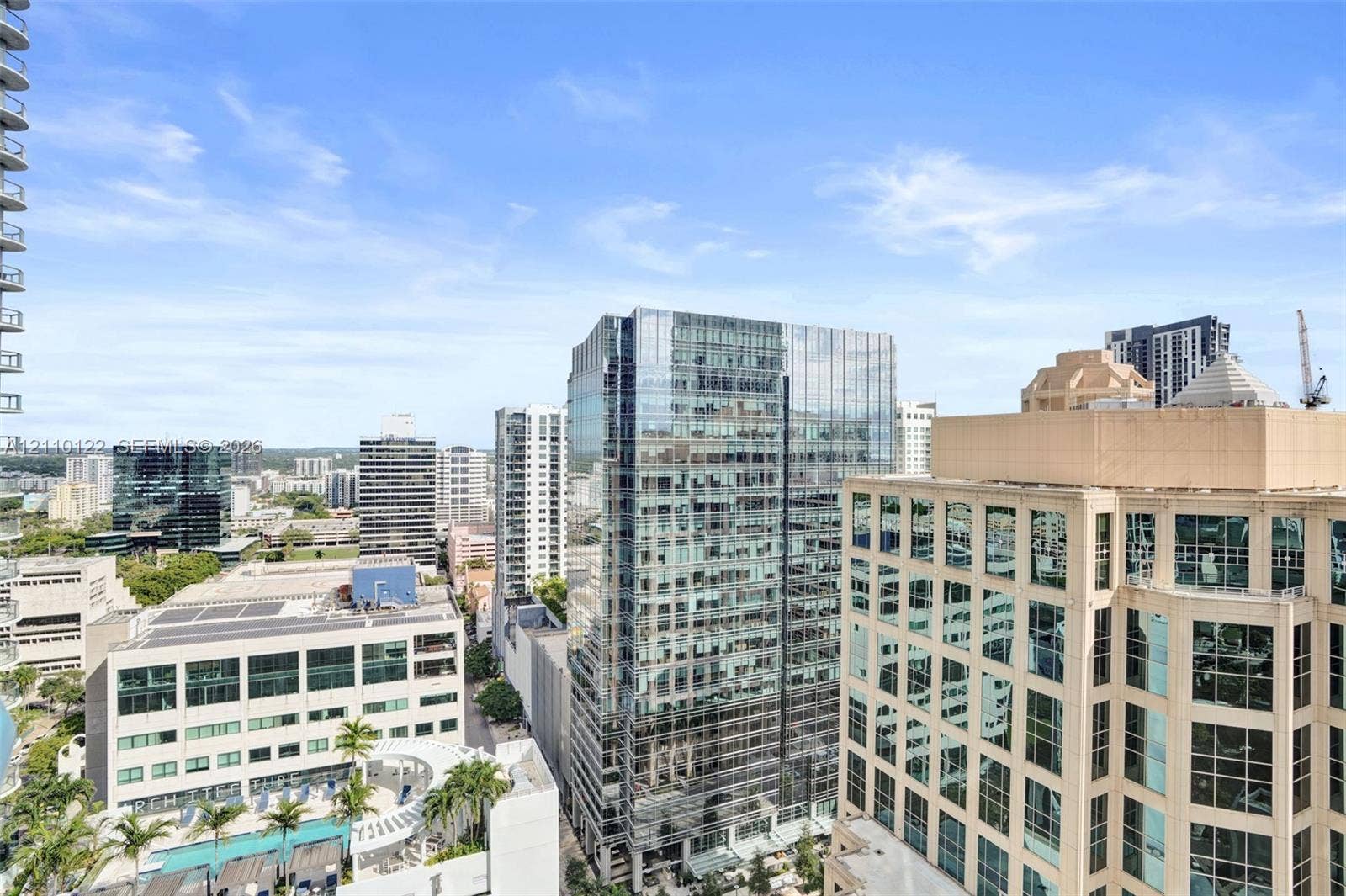 333 Las Olas Way, #2708, Fort Lauderdale, FL 33301 Elevated urban setting showcasing high-rise architecture, glass-paneled facades, and mature palm trees
