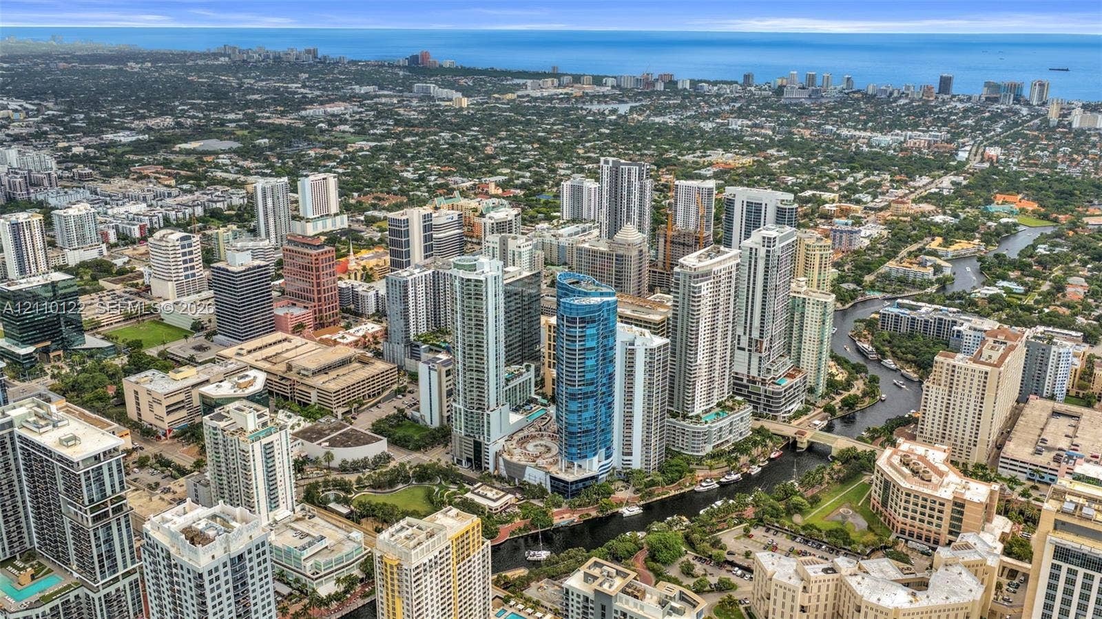 333 Las Olas Way, #2708, Fort Lauderdale, FL 33301 Aerial perspective of an urban cityscape featuring high-rise architecture, a navigable river system, coastal proximity, and established metropolitan infrastructure