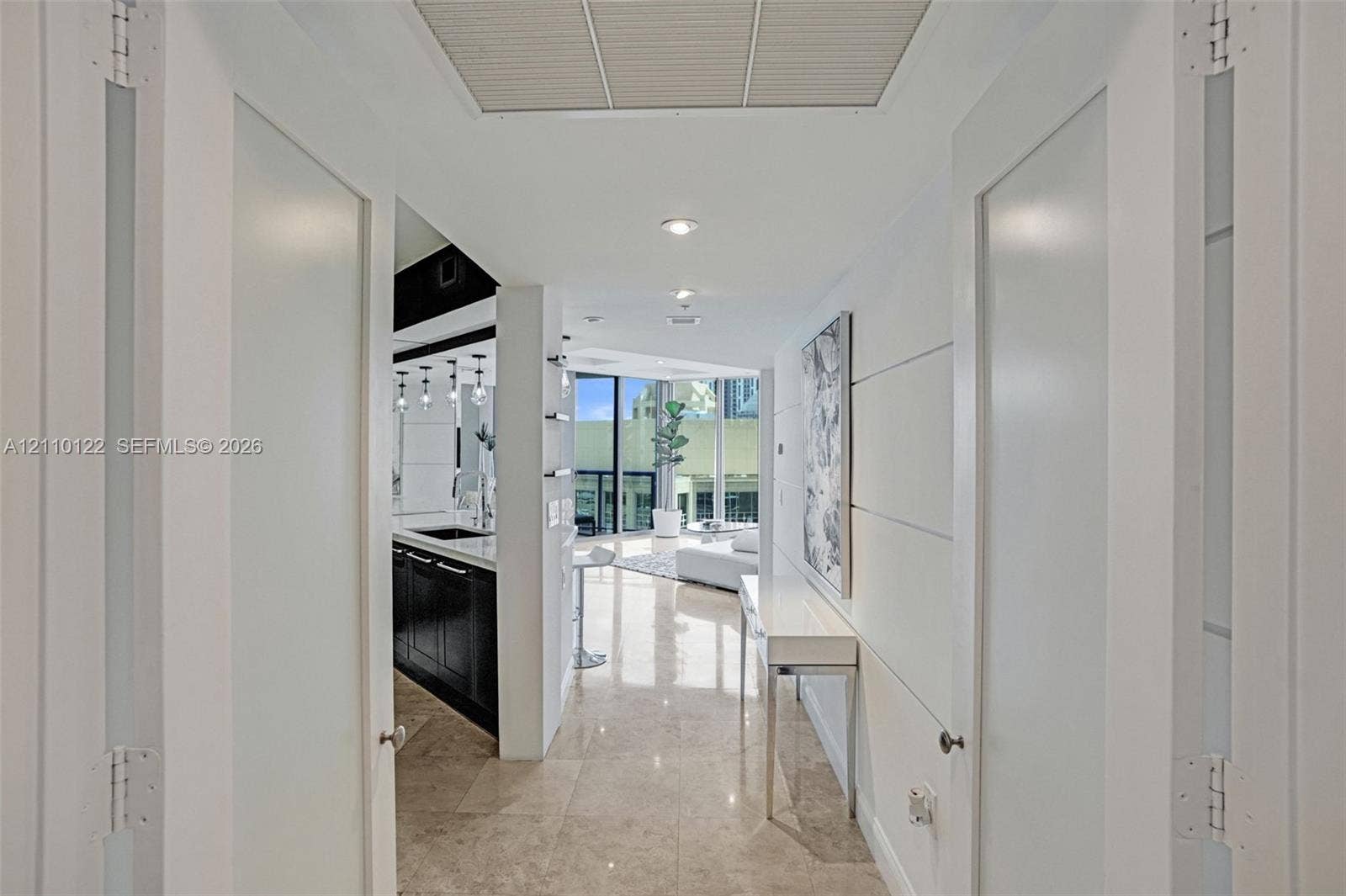 333 Las Olas Way, #2708, Fort Lauderdale, FL 33301 Entryway featuring white double doors with frosted glass insets, polished stone flooring, and recessed ceiling lighting