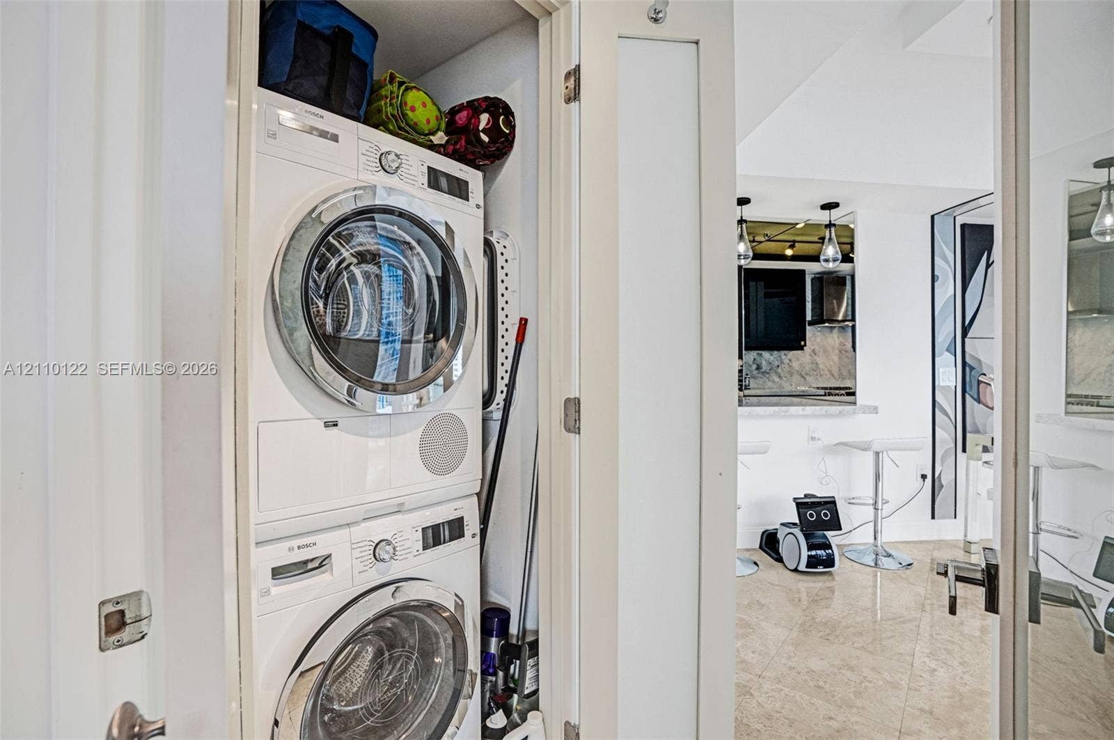333 Las Olas Way, #2708, Fort Lauderdale, FL 33301 Stackable Bosch front-load washer and dryer unit housed within a dedicated closet