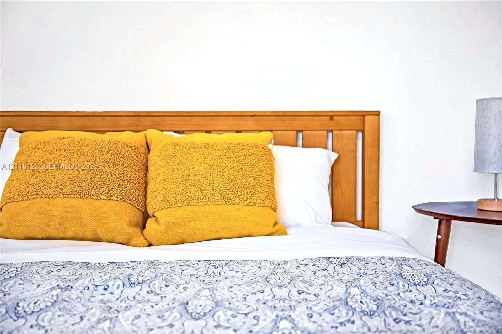 301 86th Street, #303-3, Miami Beach, Miami Beach, FL 33141 Natural wood-finish spindle headboard