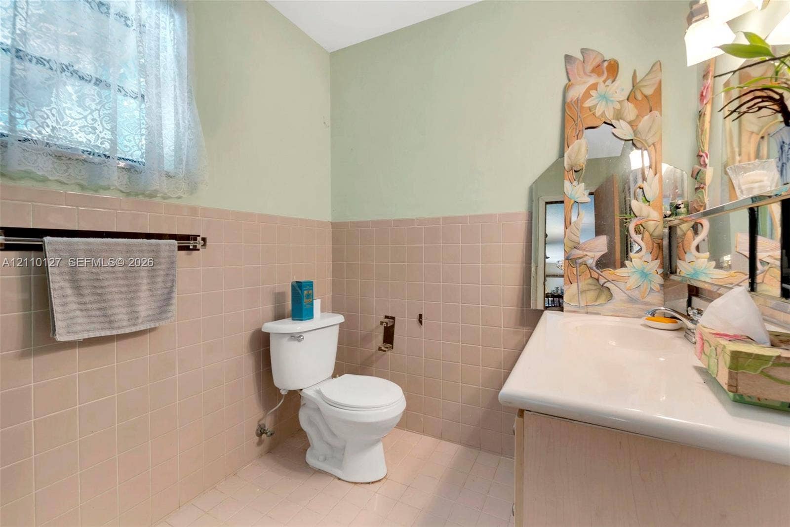 10164 SW 52nd Street, Cooper City, FL 33328 Bathroom featuring a porcelain vanity sink, ceramic wall tiling, and a window