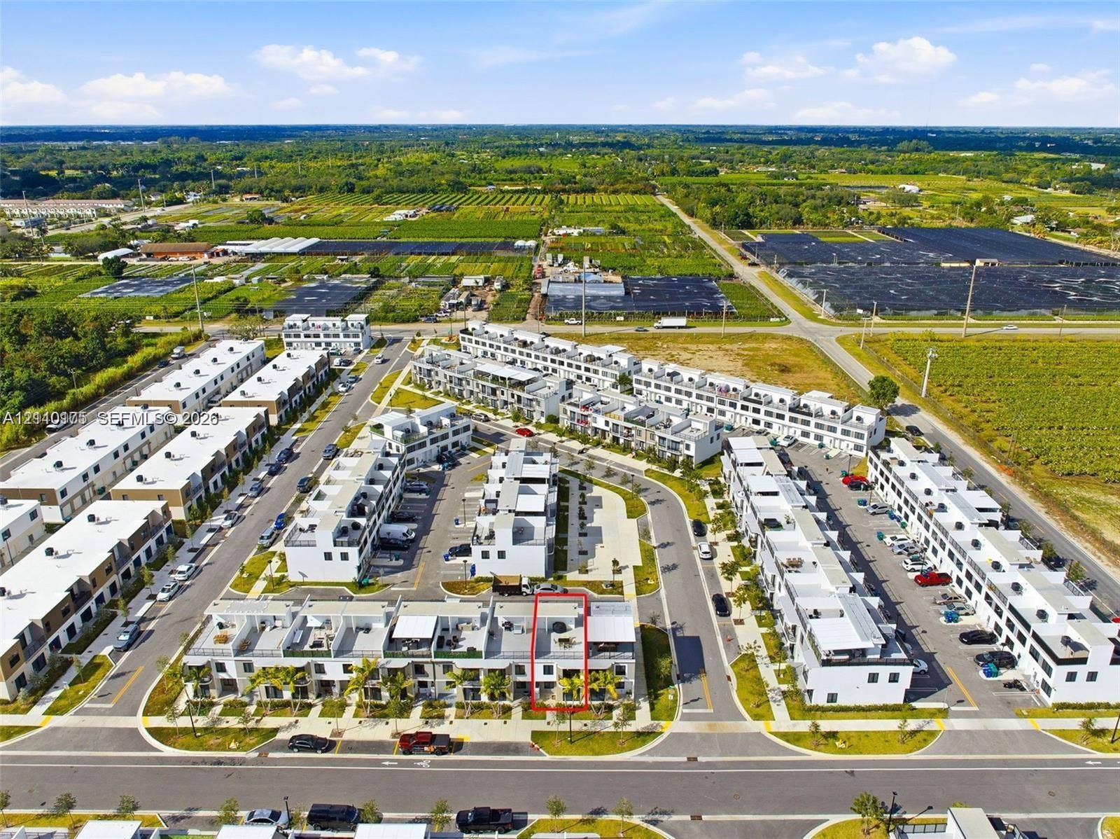 26122 SW 145th Court, #26122, Homestead, Homestead, FL 33032 Aerial view featuring multi-level townhome architecture with flat rooflines, private rooftop terraces, and dedicated on-site parking within a residential community