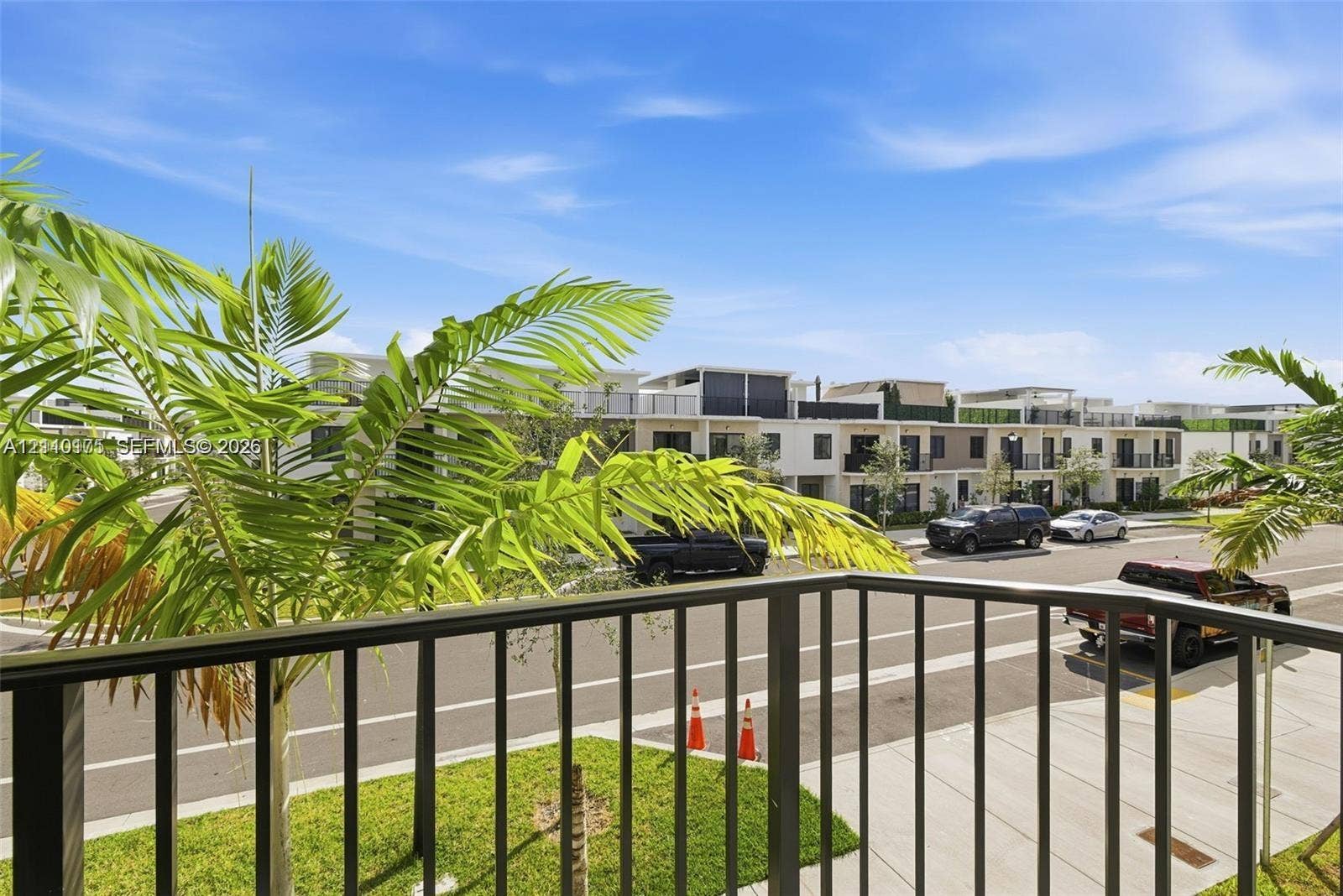 26122 SW 145th Court, #26122, Homestead, Homestead, FL 33032 Exterior balcony featuring metal railings and palm foliage