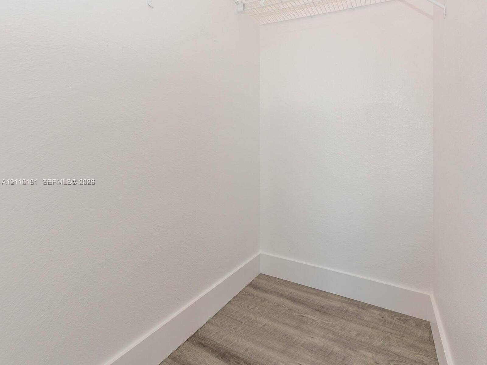 8999 NW 107 Court, #218-1, Miami, Miami, FL 33178 Storage space featuring neutral wall finishes and wood-finish flooring with installed wire shelving