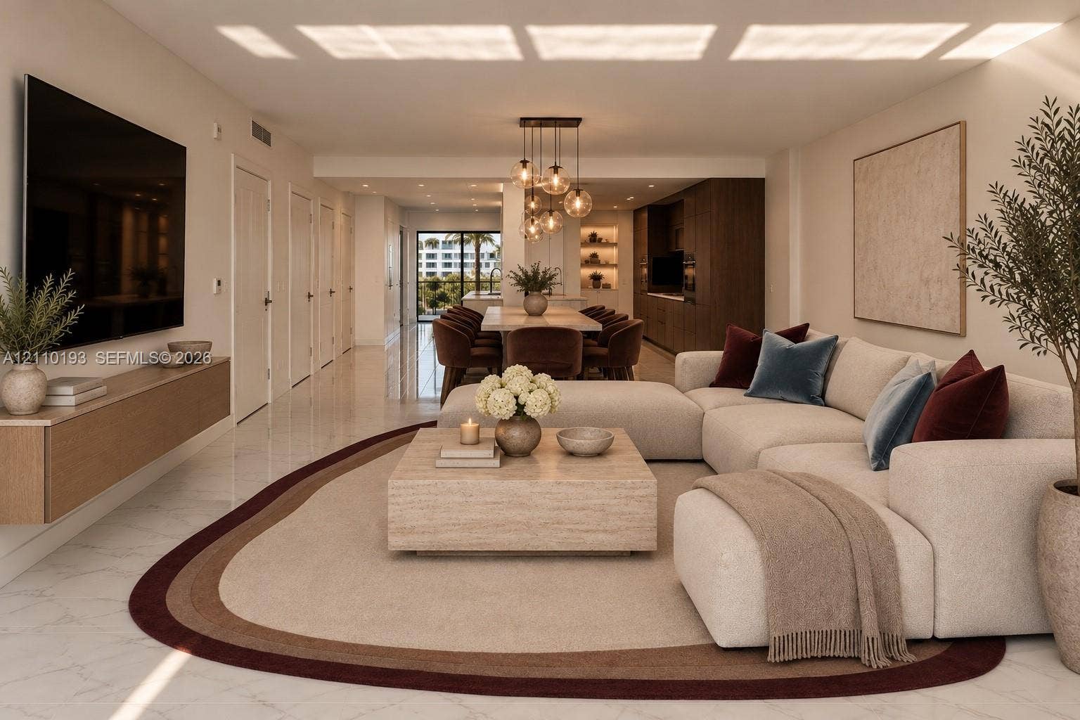 Open-concept living space featuring polished stone flooring, a wall-mounted wood-finish media console, custom built-in cabinetry, and multi-pendant globe lighting - virtual staging