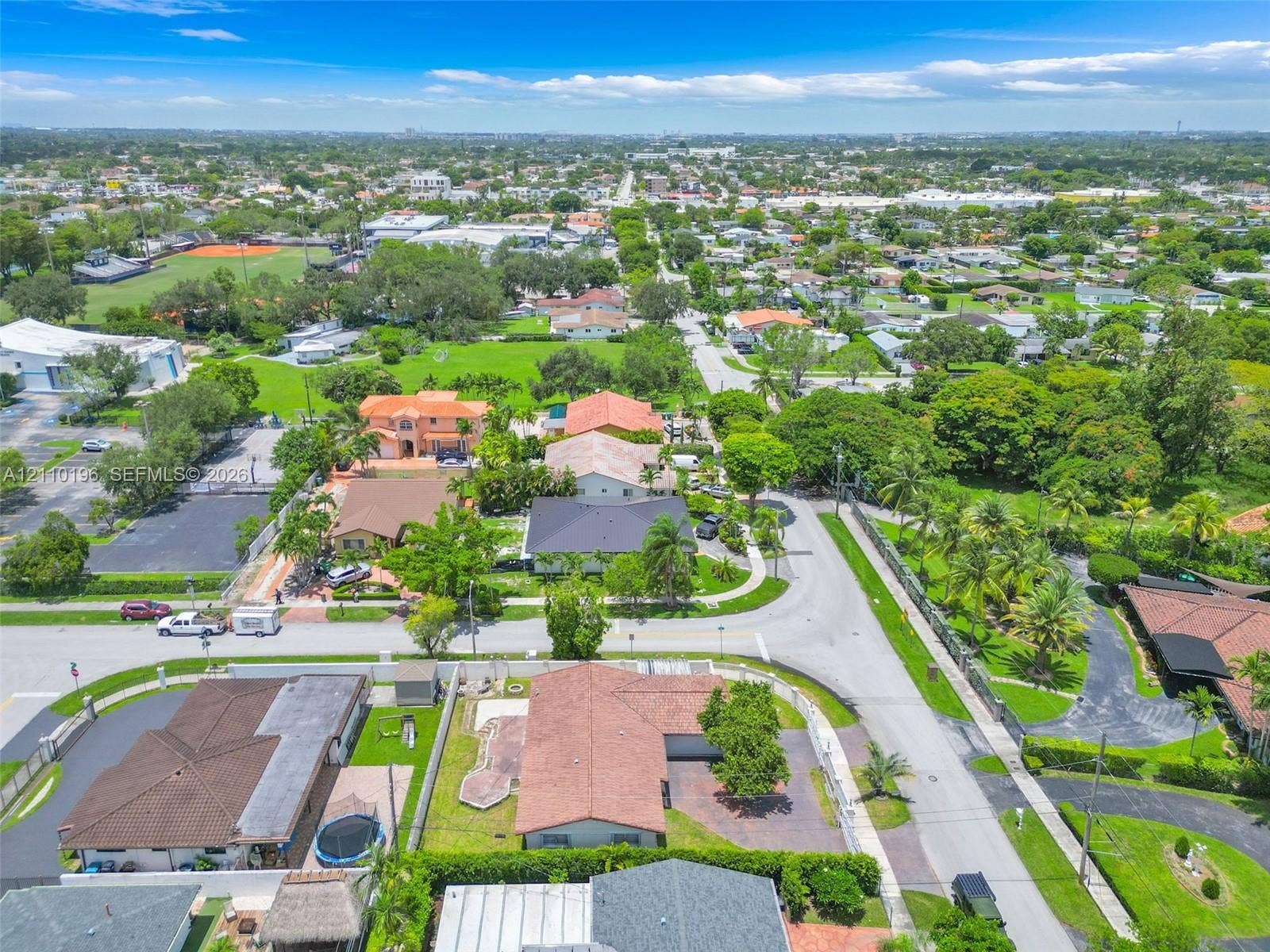 4400 SW 89th Avenue, #4400, Miami, Miami, FL 33165 Aerial perspective of a suburban neighborhood featuring paved street infrastructure, mature landscaping, diverse residential roof styles, and abundant green space