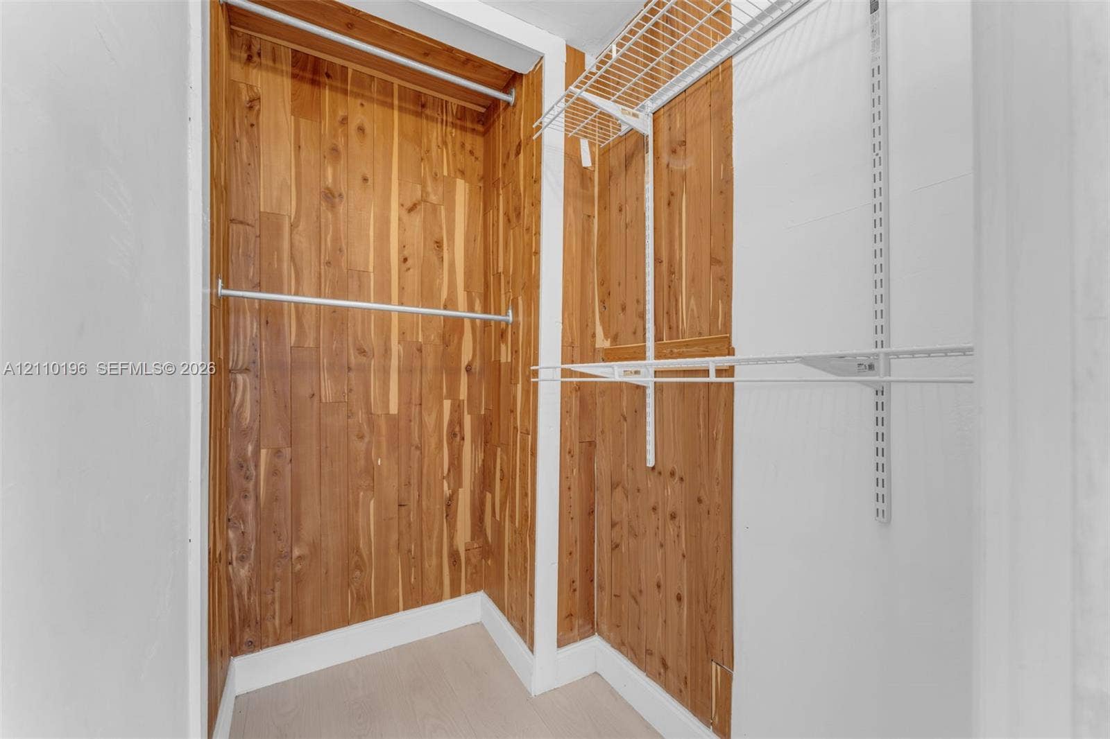 4400 SW 89th Avenue, #4400, Miami, Miami, FL 33165 Walk-in closet featuring cedar-lined interior walls, integrated wire shelving, and metal garment rods
