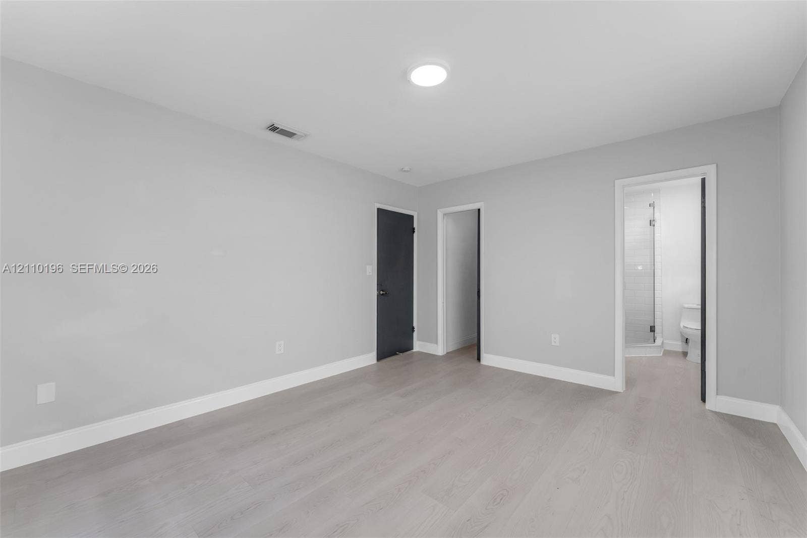 4400 SW 89th Avenue, #4400, Miami, Miami, FL 33165 Neutral interior space featuring wood-finish flooring, recessed lighting, and solid-core doors