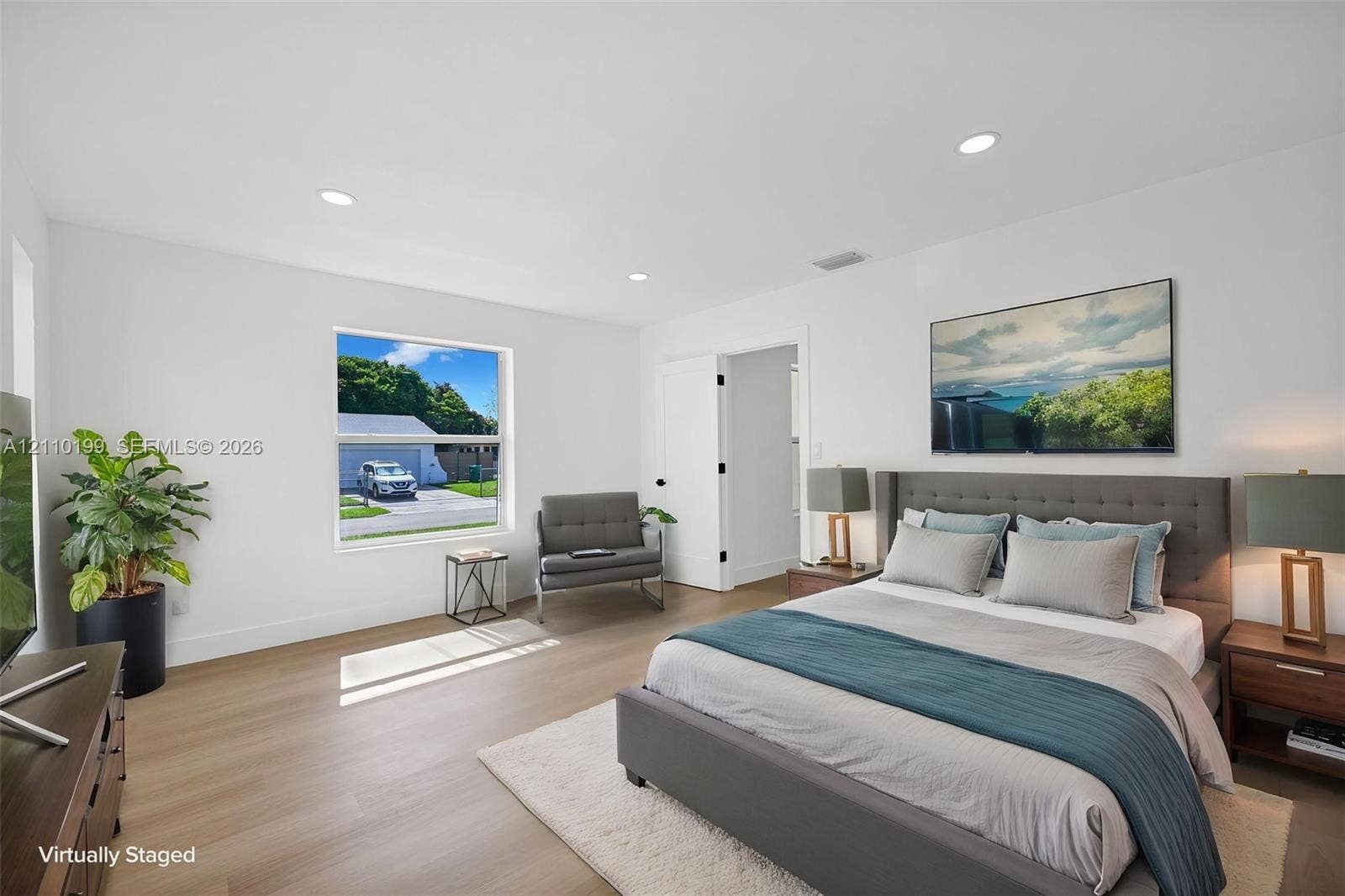 10741 SW 165th Street, Miami, FL 33157 Bedroom featuring wood-finish flooring, recessed lighting, and a single-pane window