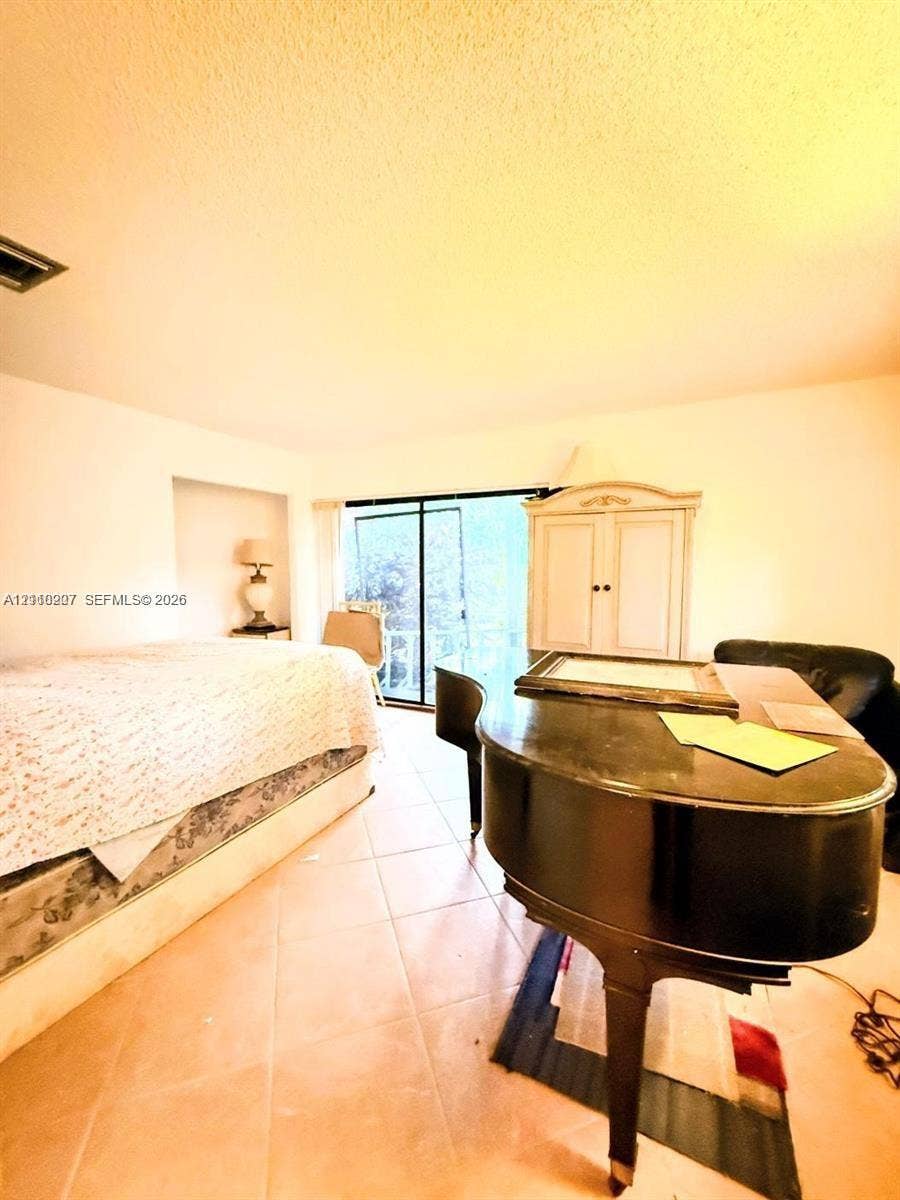 766 NW 24th Avenue, Delray Beach, FL 33445 Ceramic tile flooring, built-in recessed wall shelving, and floor-to-ceiling glass sliding doors