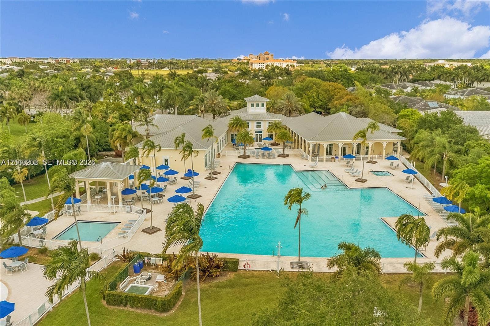 657 SE 30th Terrace, #A, Homestead, Homestead, FL 33033 Large-scale swimming pool featuring a lap lane, integrated spa, covered pavilion, and surrounding stone-paver deck