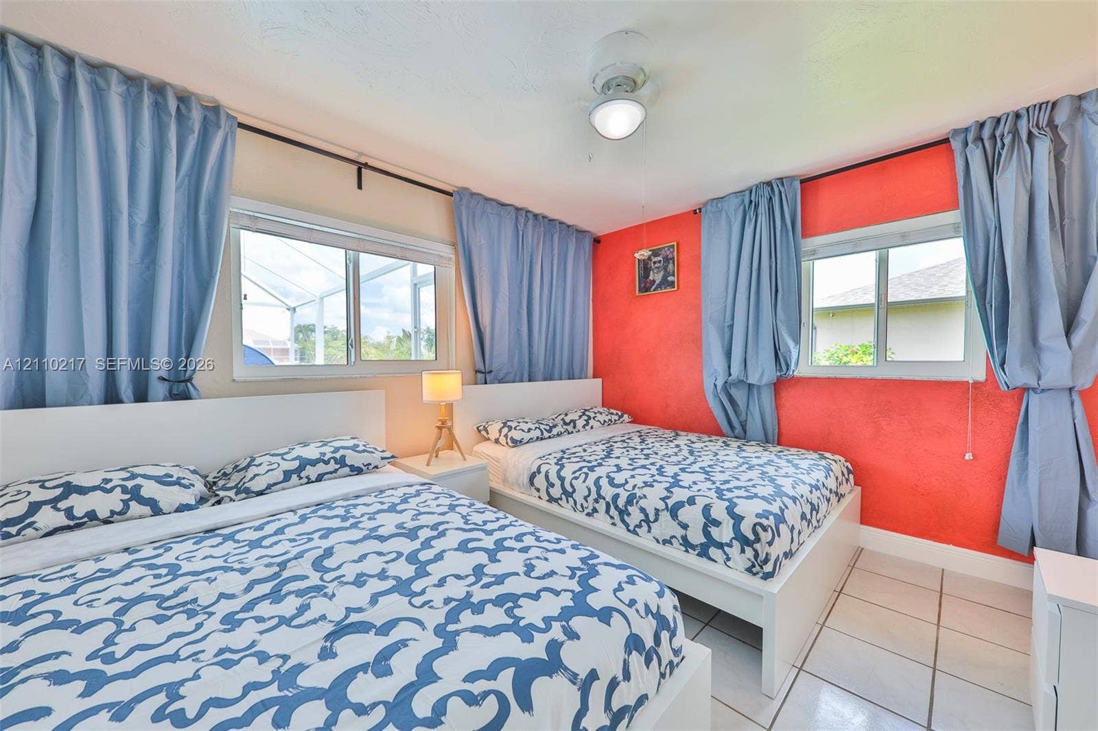 503 SW 17 Street, Cape Coral, FL 33990 Room featuring dual horizontal sliding windows, tile flooring, and a central ceiling fan