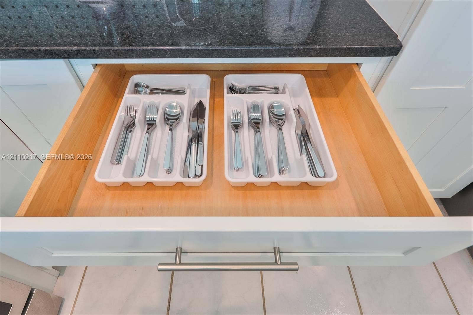503 SW 17 Street, Cape Coral, FL 33990 Drawer featuring natural wood-finish construction, brushed metal bar hardware, and solid-surface countertop