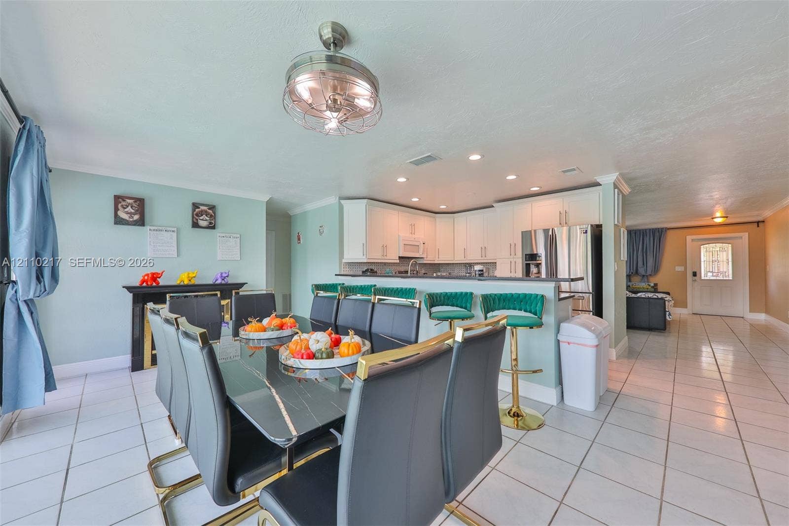 503 SW 17 Street, Cape Coral, FL 33990 Open-concept kitchen featuring white cabinetry, recessed lighting, and a breakfast bar