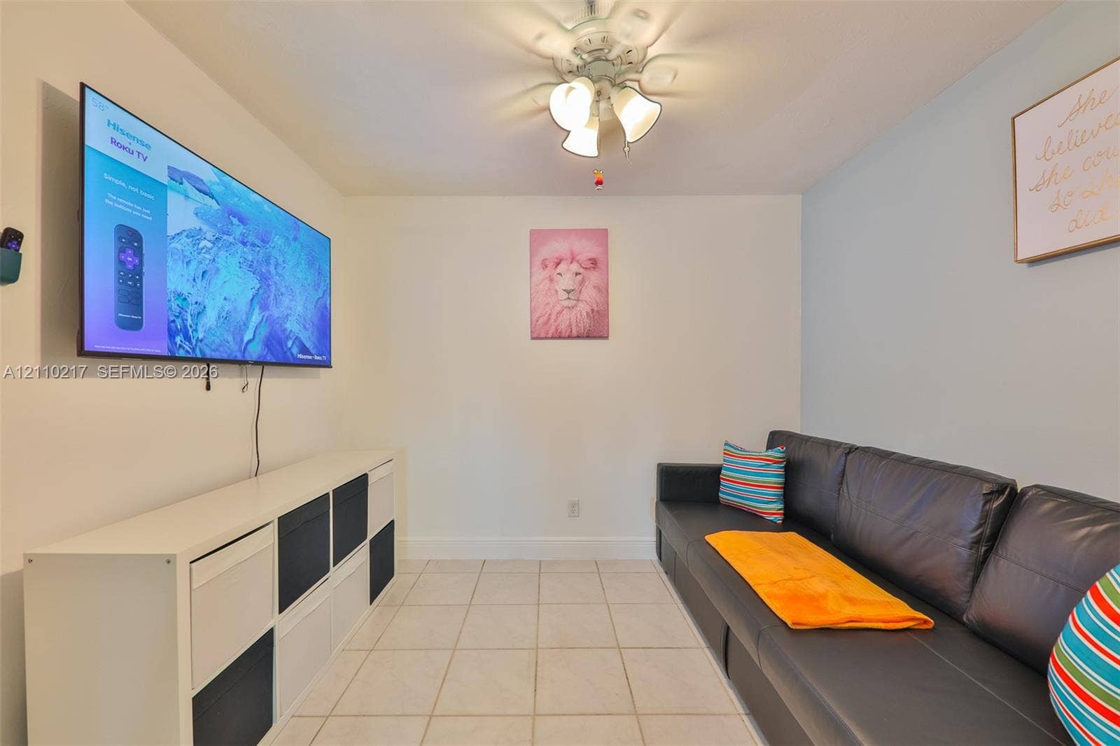 503 SW 17 Street, Cape Coral, FL 33990 Interior space featuring neutral wall tones, ceramic tile flooring, and a multi-light ceiling fan