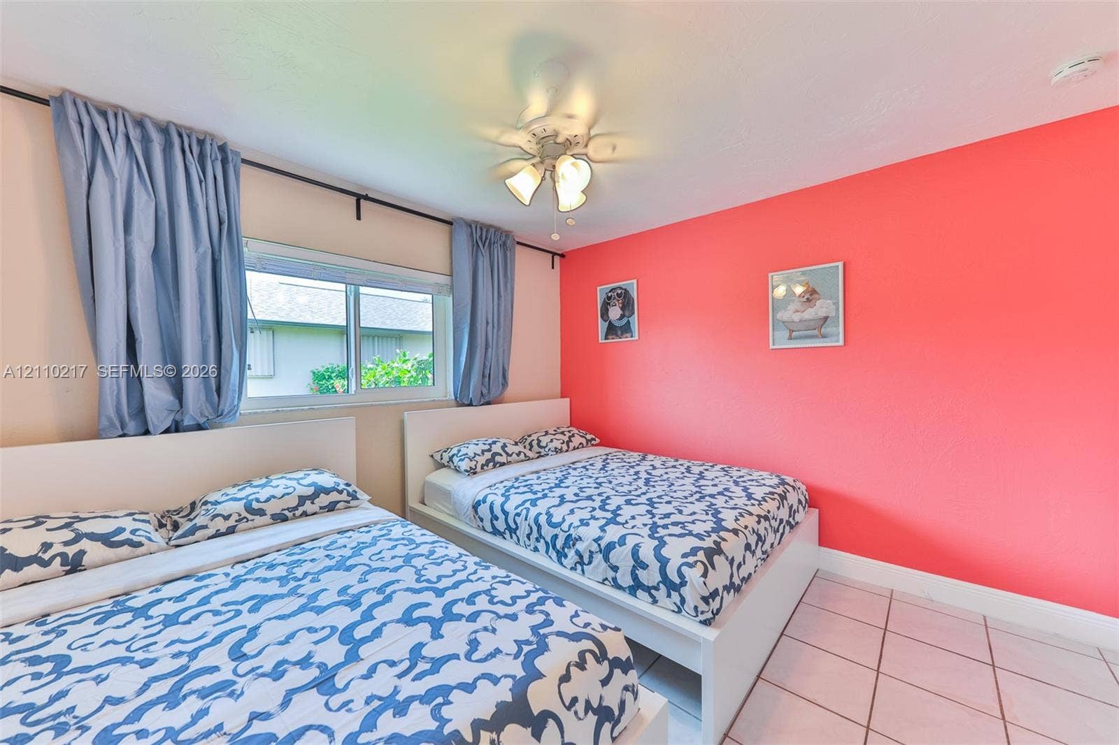 503 SW 17 Street, Cape Coral, FL 33990 Tile flooring, white-finish ceiling fan with integrated lighting, and horizontal sliding window