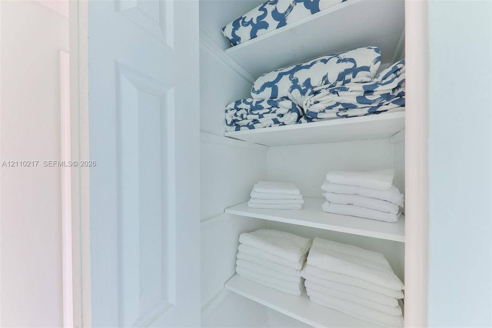 503 SW 17 Street, Cape Coral, FL 33990 Storage closet featuring white interior finishes and four built-in shelves
