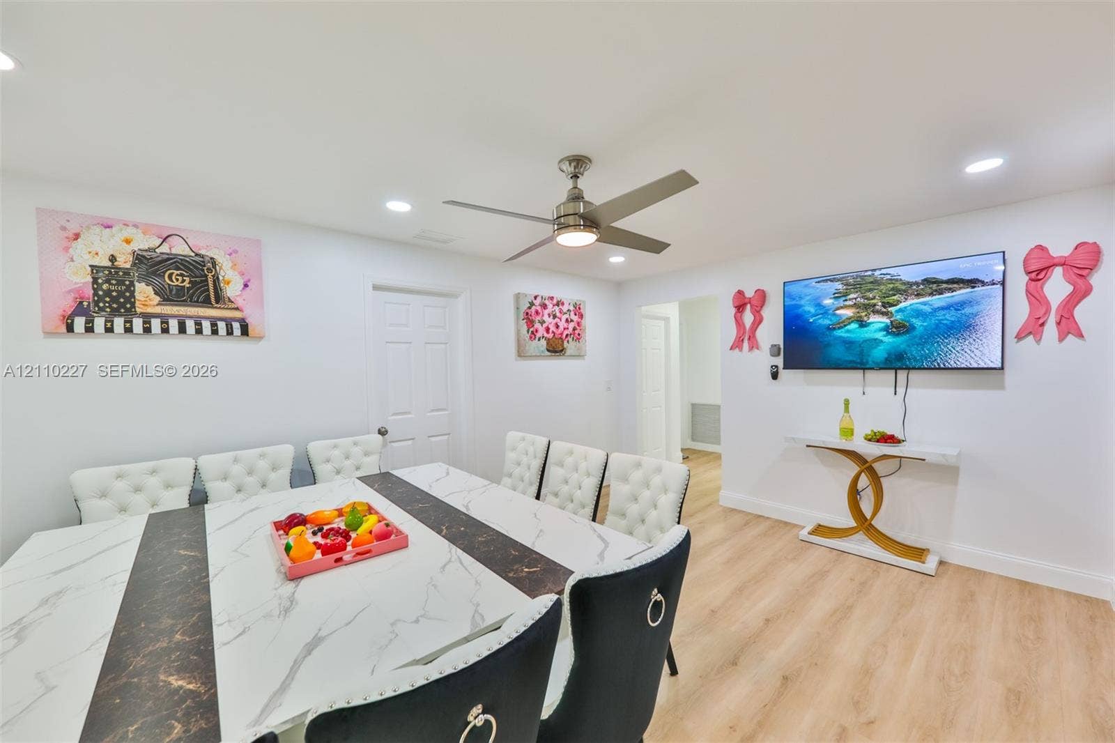 450 Bayshore Drive, Cape Coral, FL 33904 Neutral interior space featuring wood-finish flooring, recessed lighting, and a modern brushed-nickel ceiling fan