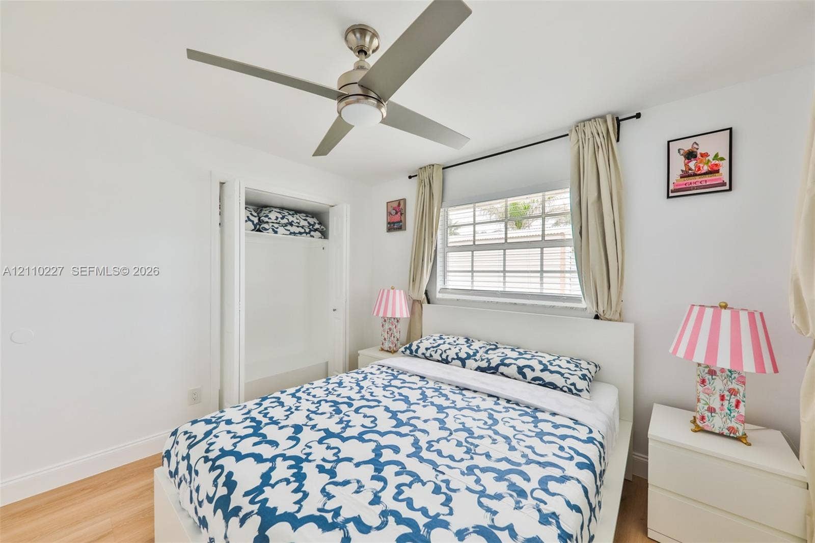 450 Bayshore Drive, Cape Coral, FL 33904 Wood-finish flooring, ceiling fan with integrated lighting, multi-pane window, and built-in closet