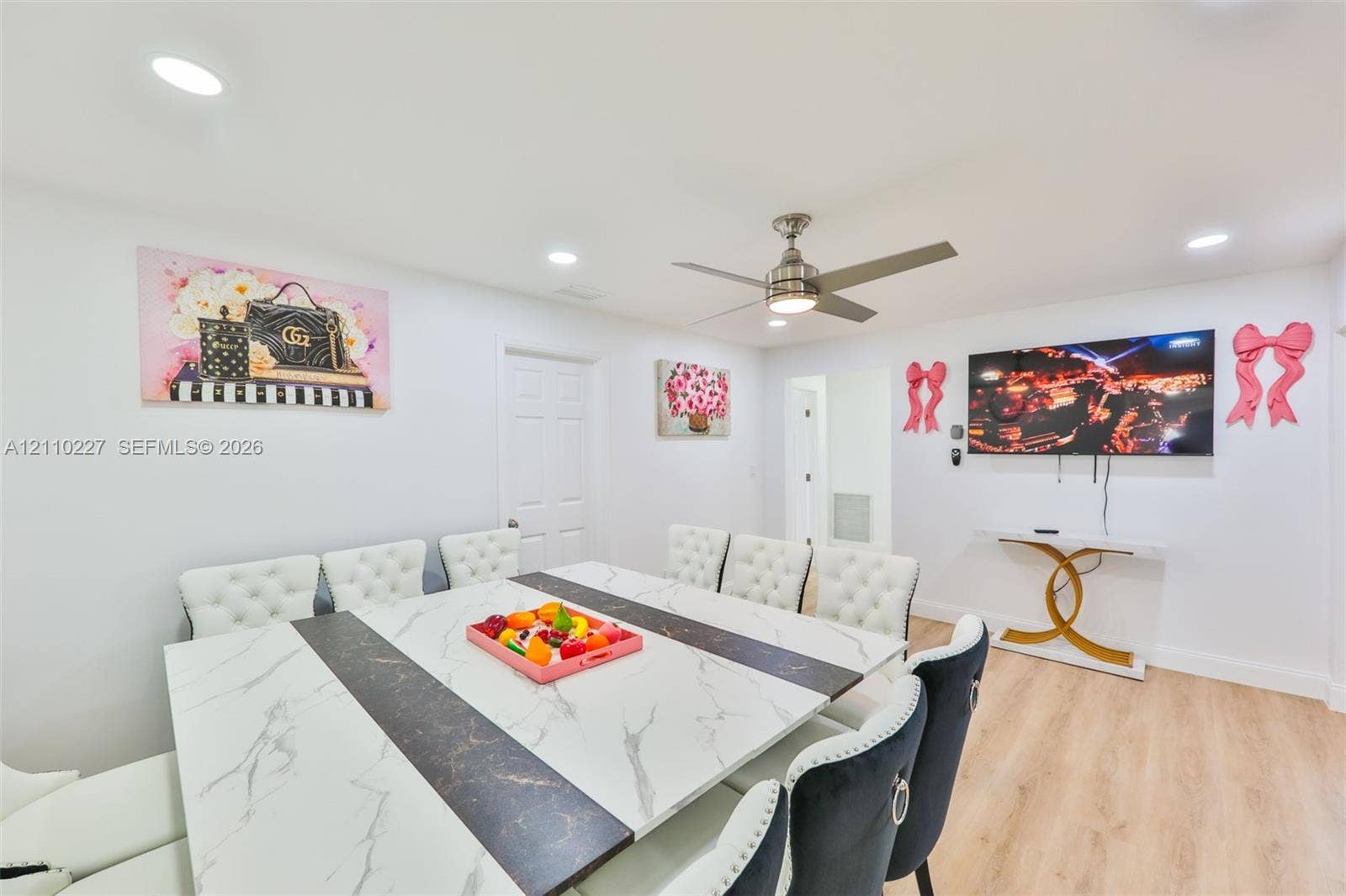 450 Bayshore Drive, Cape Coral, FL 33904 Open-concept room featuring recessed lighting, a brushed-nickel ceiling fan, and light-toned wood-finish flooring