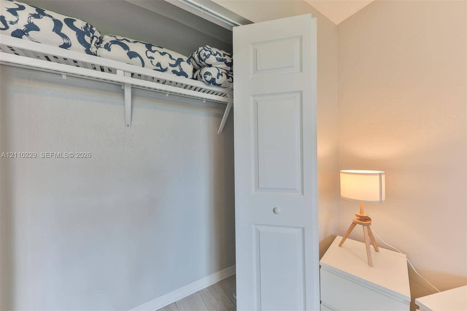 Closet featuring white bi-fold doors and integrated wire shelving