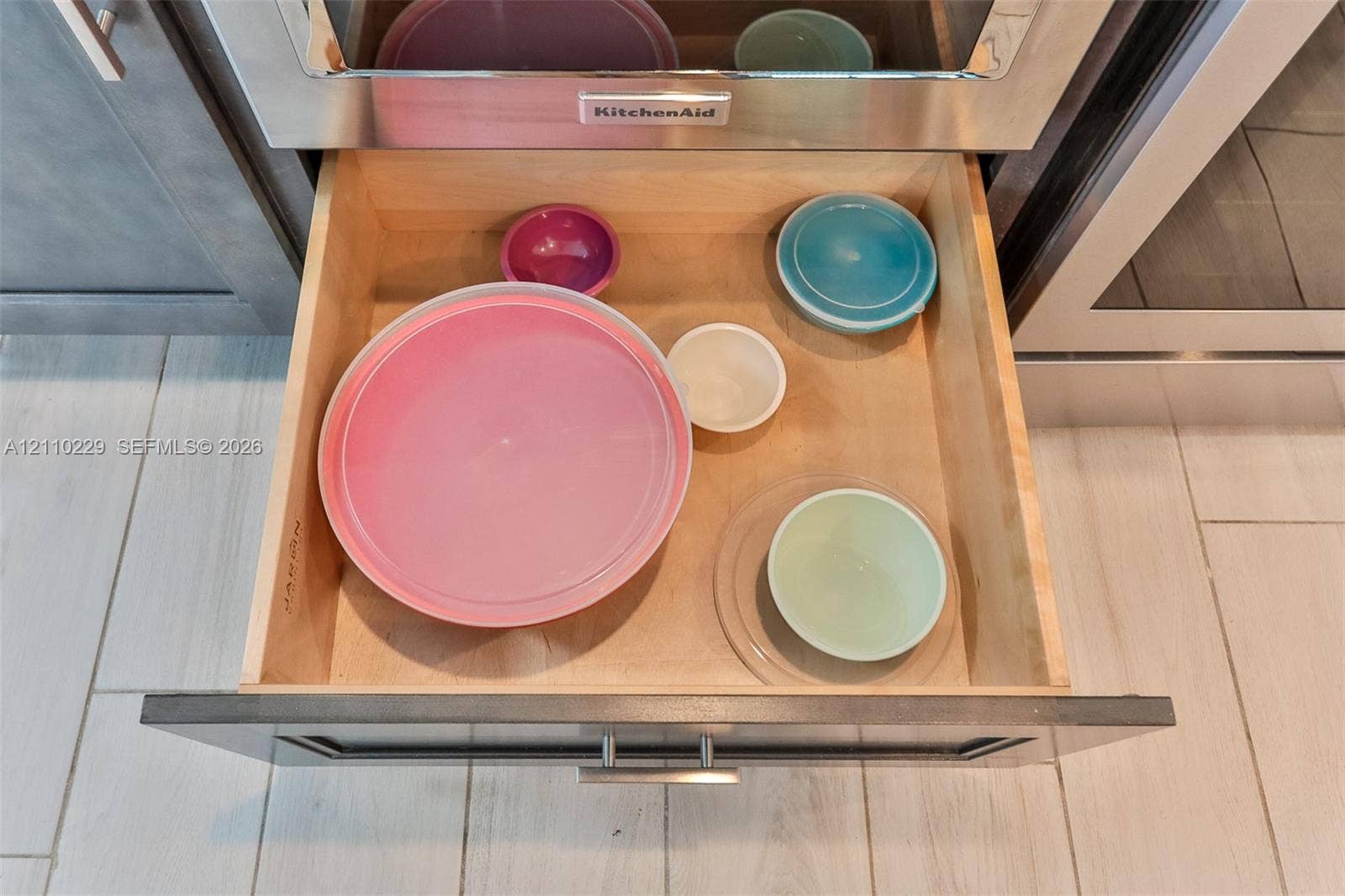 Deep-drawer cabinetry featuring natural wood construction, full-extension glides, and modern stainless steel hardware