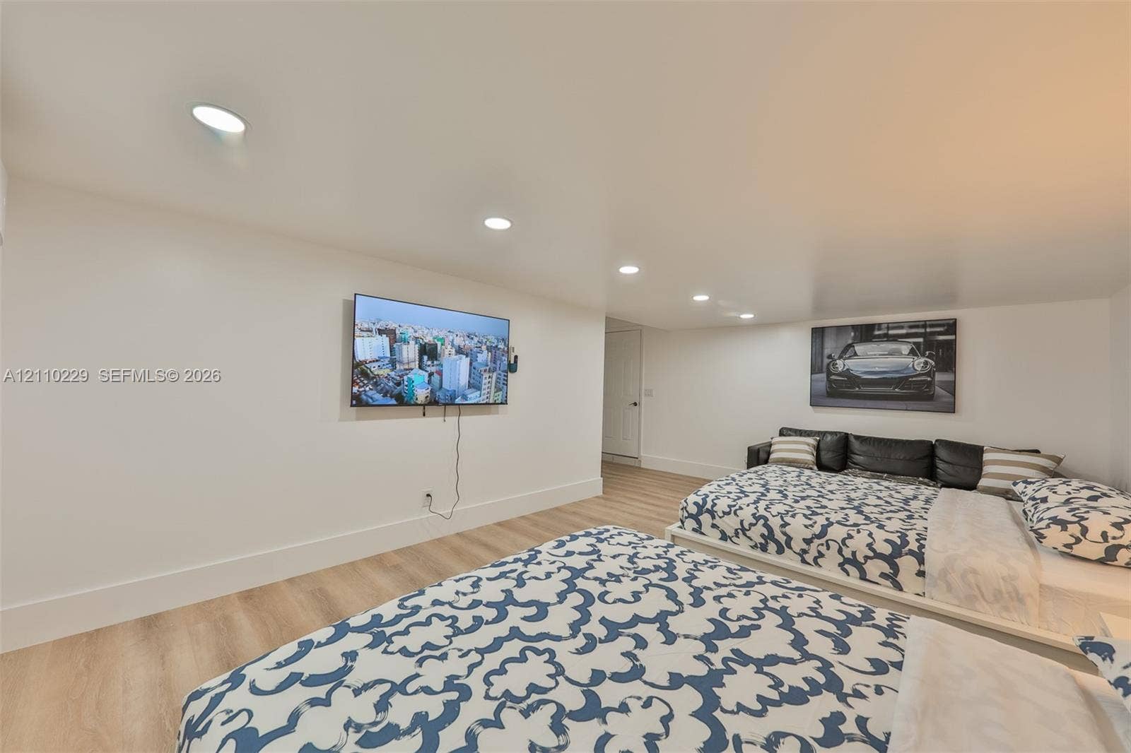 Interior space featuring wood-finish flooring and recessed lighting