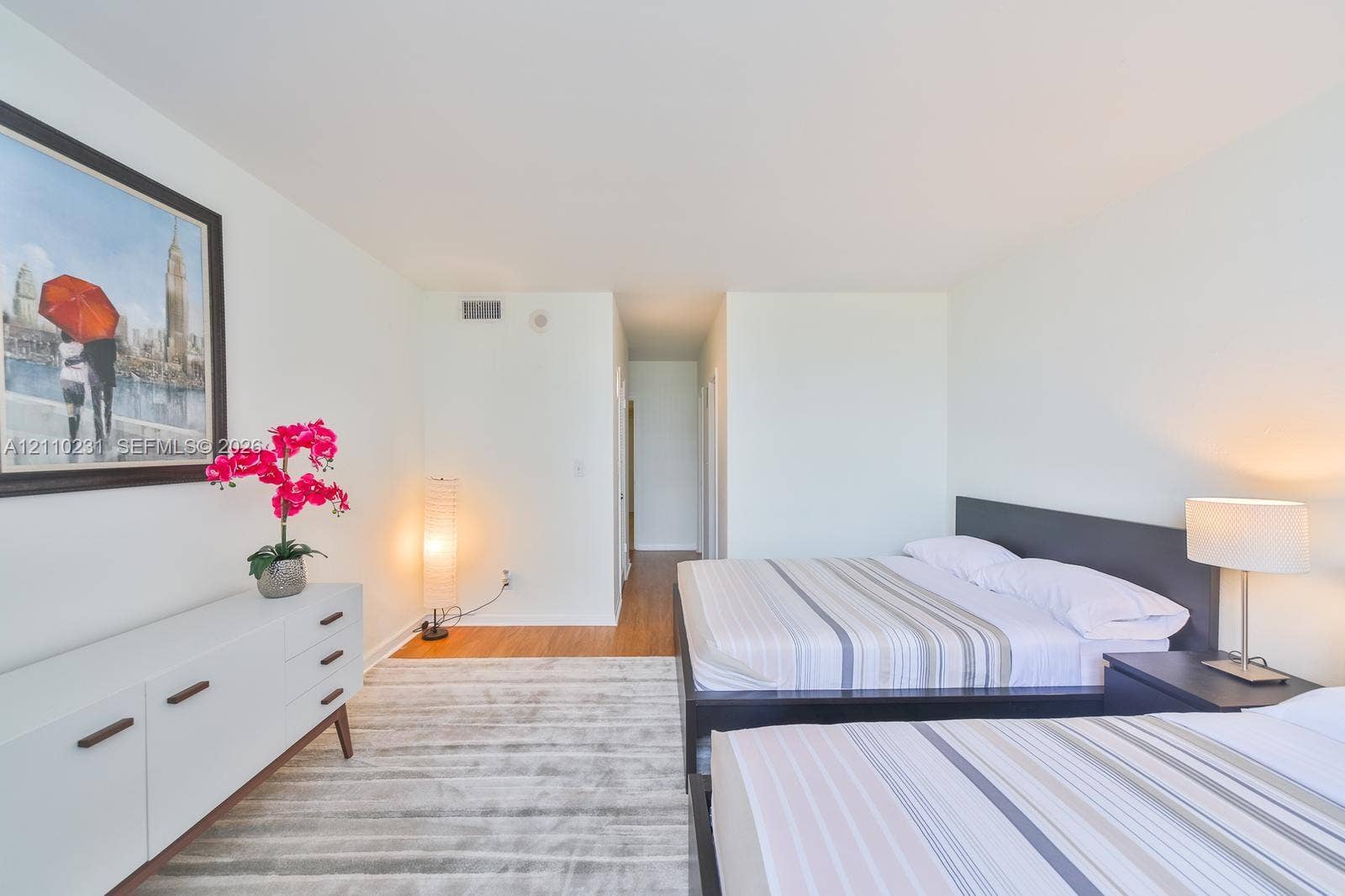 19370 Collins Avenue, #622, Sunny Isles Beach, FL 33160 Spacious room featuring neutral paint, wood-finish flooring, and crisp architectural lines