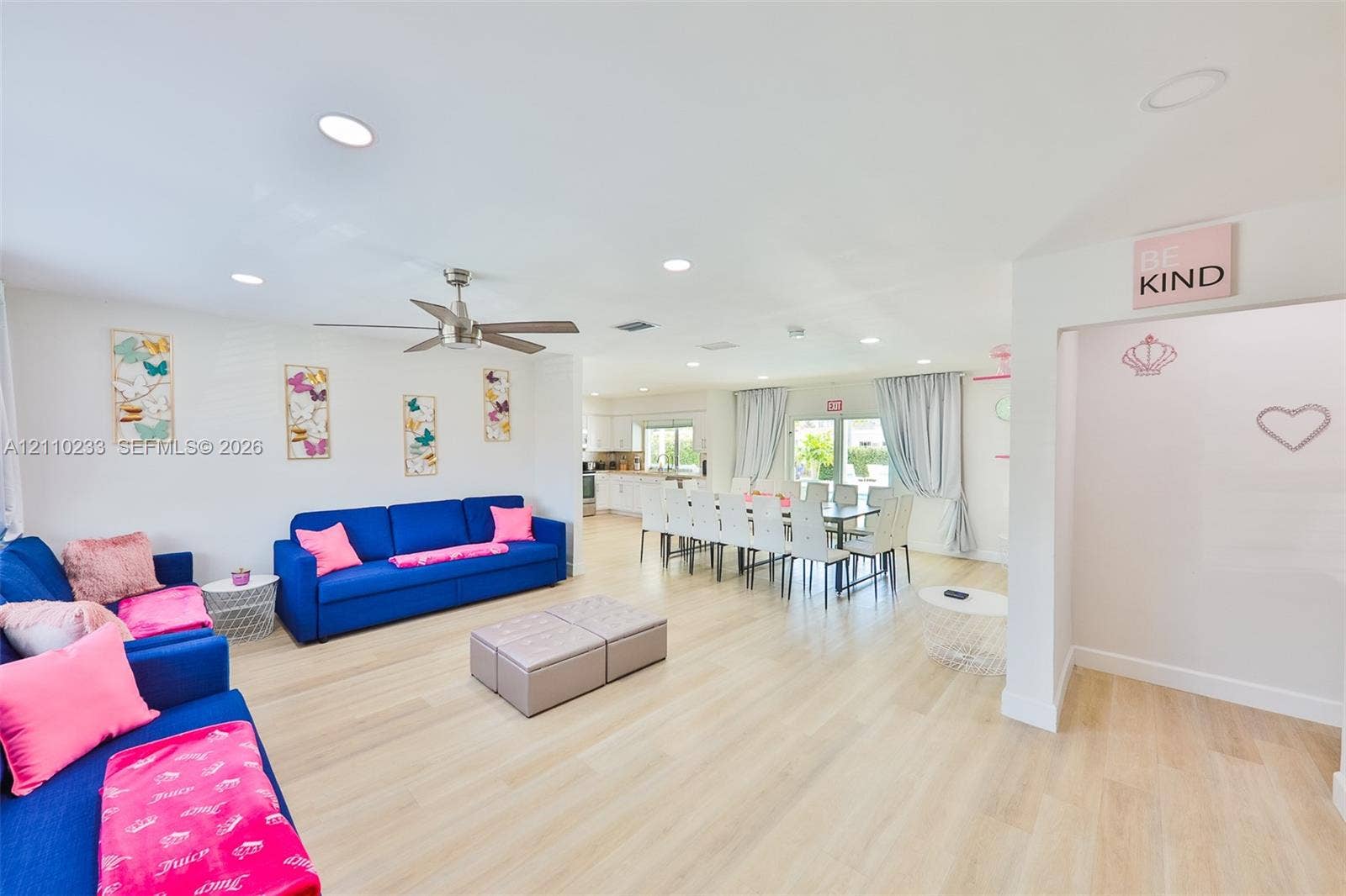 614 S Crescent Drive, Hollywood, FL 33021 Open-concept interior featuring light wood-finish flooring, recessed lighting, and a neutral color palette with an integrated ceiling fan
