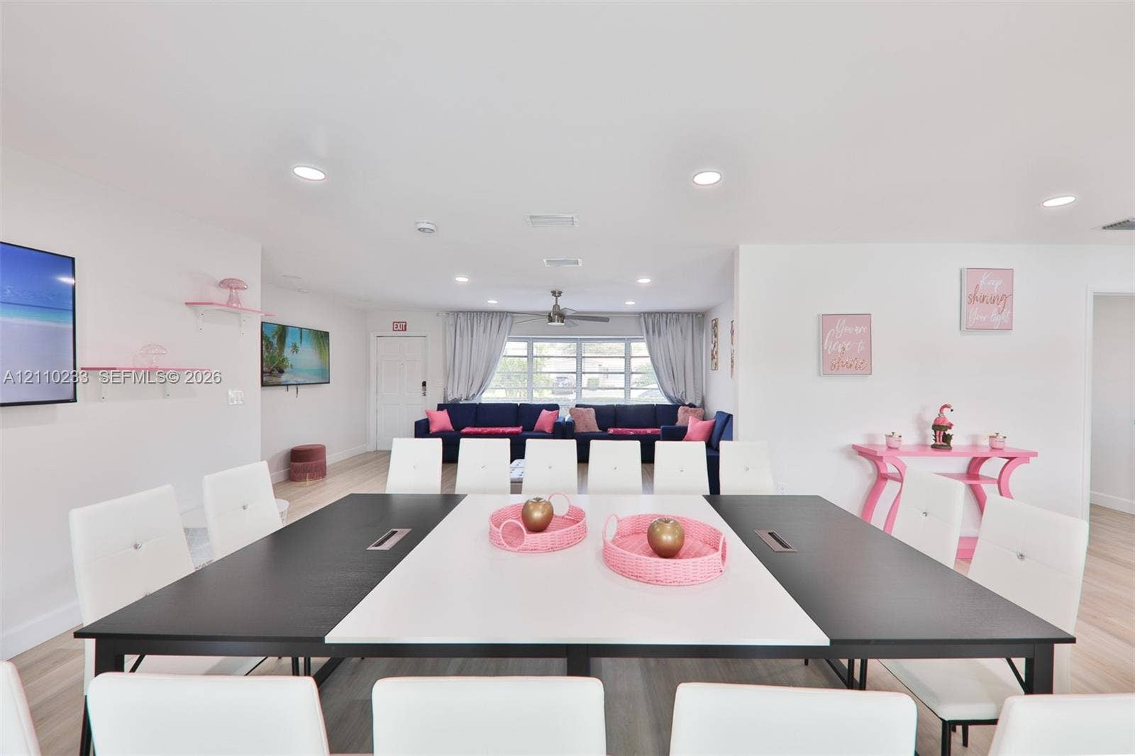 614 S Crescent Drive, Hollywood, FL 33021 Open interior featuring recessed lighting, wood-finish flooring, and white wall-mounted shelving