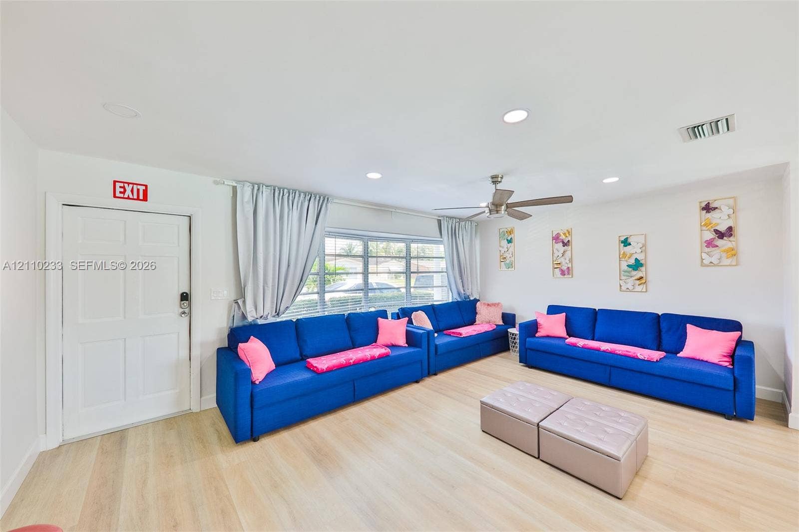 614 S Crescent Drive, Hollywood, FL 33021 Neutral interior featuring light-tone wood-finish flooring, recessed lighting, a ceiling fan, and multi-pane windows