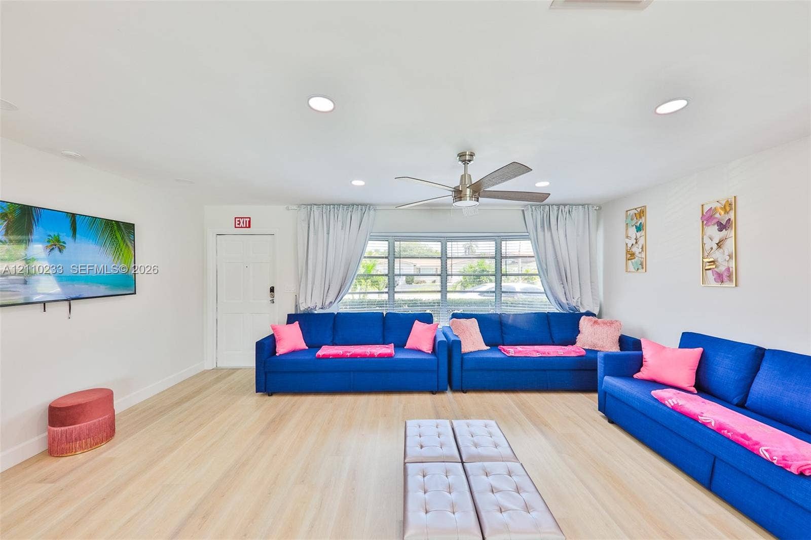 614 S Crescent Drive, Hollywood, FL 33021 Living area featuring light-toned wood-finish flooring, recessed lighting, and a multi-blade ceiling fan