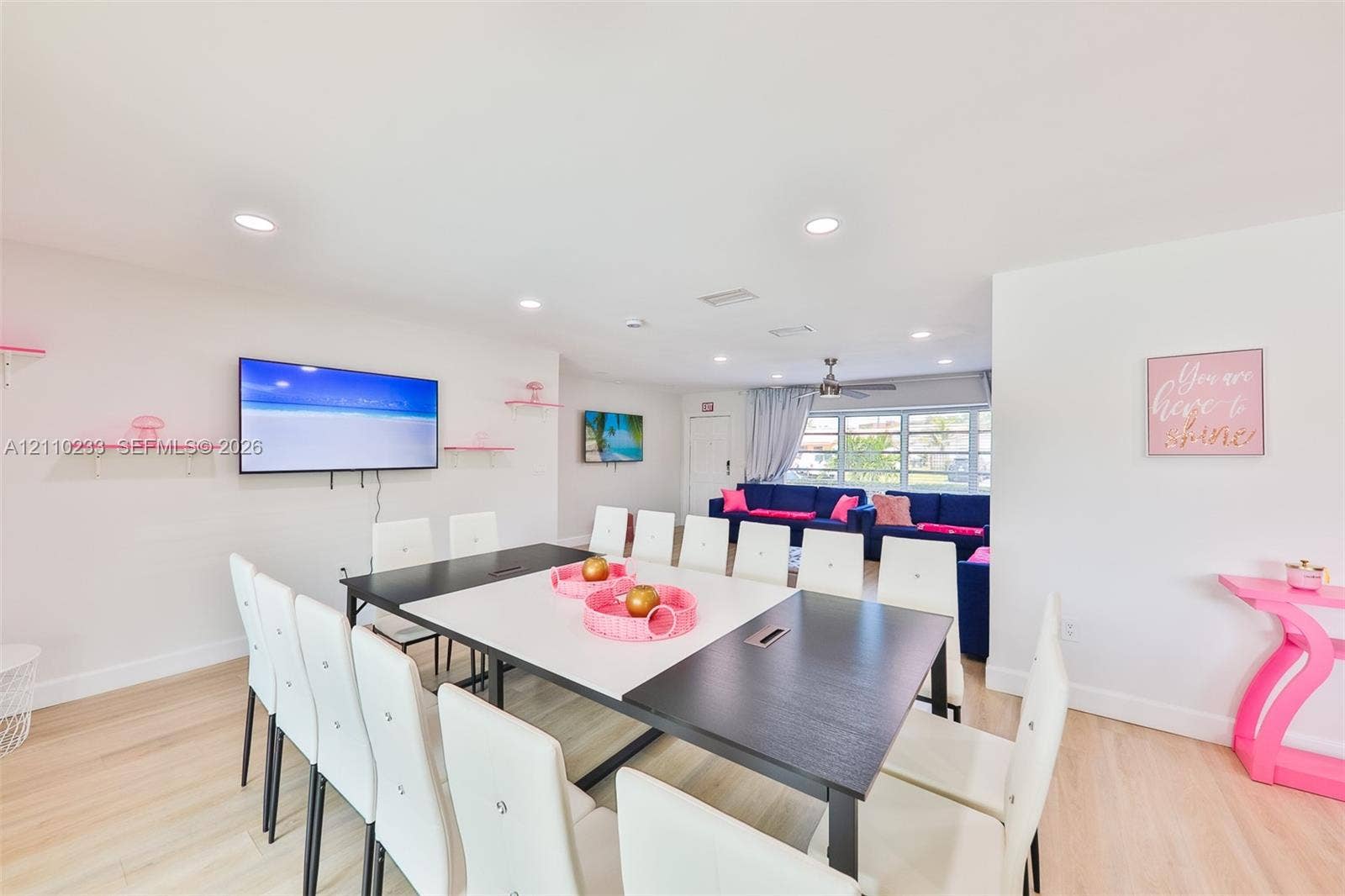 614 S Crescent Drive, Hollywood, FL 33021 Open-concept room featuring wood-finish flooring, recessed lighting, and wall-mounted shelving