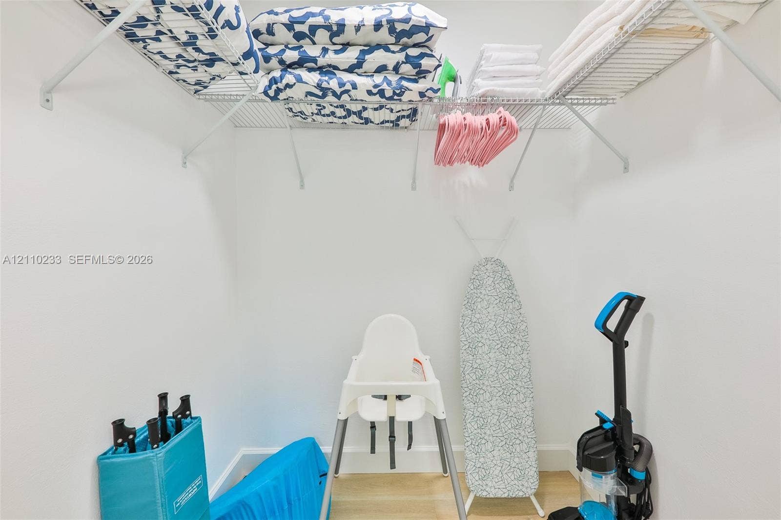 614 S Crescent Drive, Hollywood, FL 33021 Storage space featuring wall-mounted wire shelving and neutral wall finishes