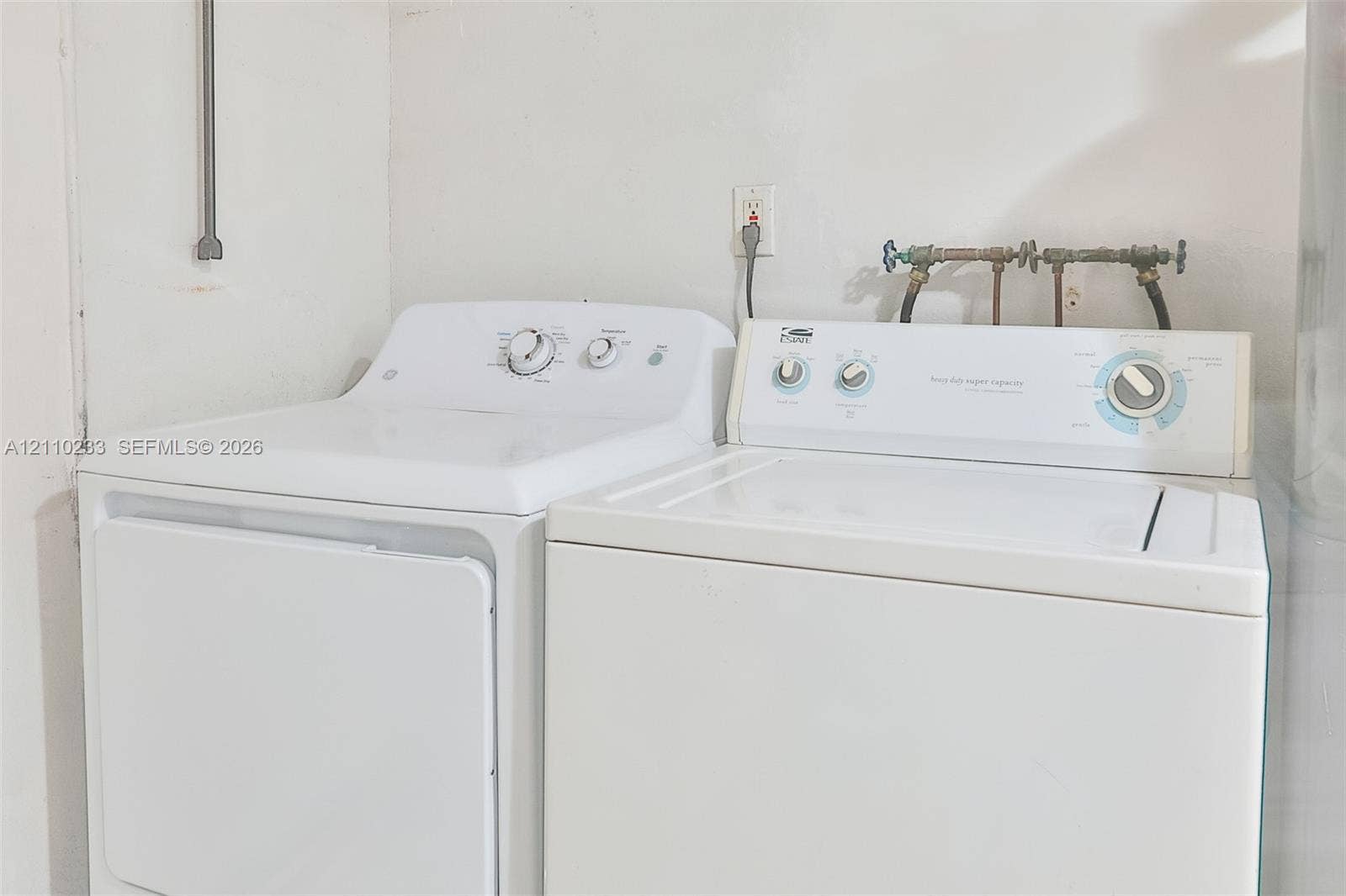 614 S Crescent Drive, Hollywood, FL 33021 Laundry area equipped with washer and dryer hookups, electrical outlets, and plumbing connections