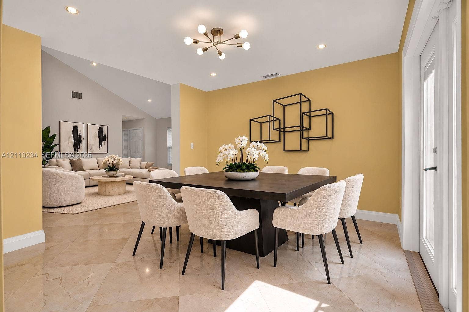 Vaulted ceilings featuring recessed lighting, large-format tile flooring, and a modern multi-arm chandelier