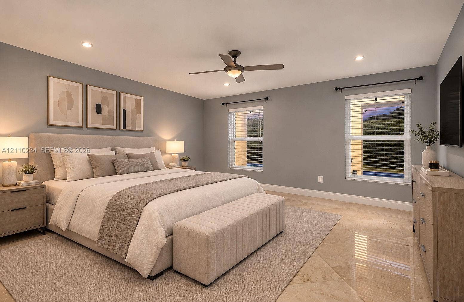 Polished stone flooring, recessed lighting, ceiling fan with integrated light, and dual double-pane windows