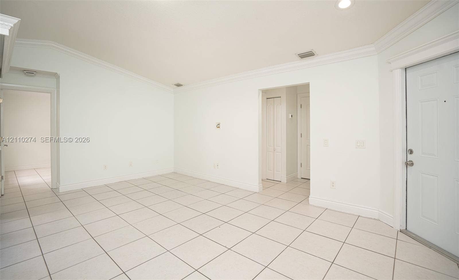 14955 SW 49th Lane, #5E, Miami, FL 33185 Interior room featuring neutral ceramic tile flooring, vaulted ceilings, recessed lighting, and crown molding