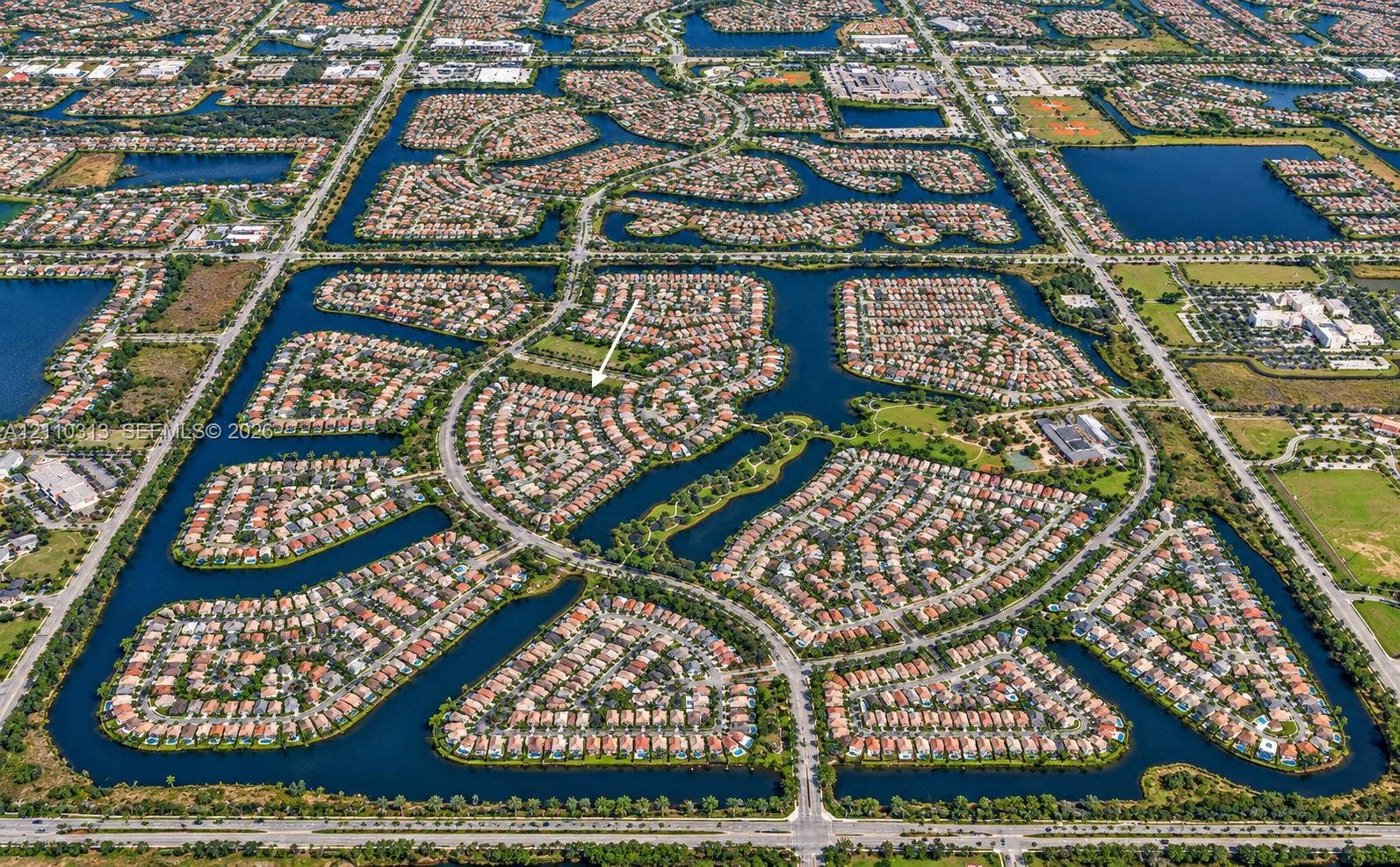 17731 SW 23rd Street, Miramar, FL 33029 Aerial perspective of a planned community featuring winding residential streets and multiple surrounding waterways