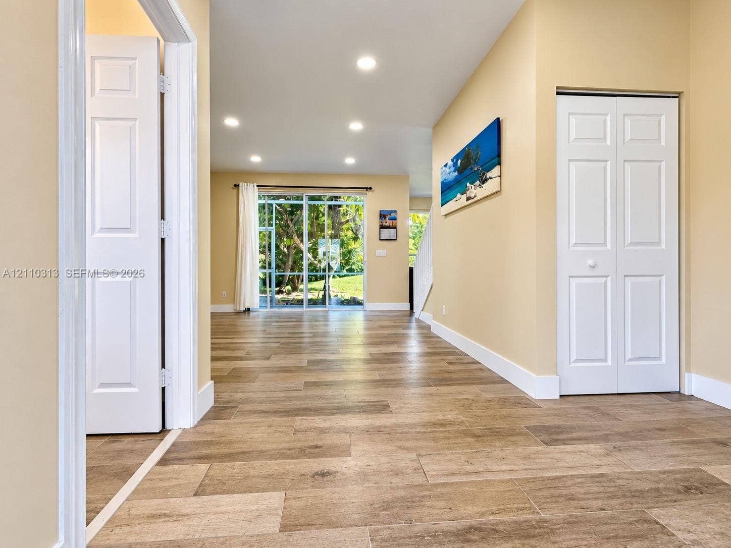 17731 SW 23rd Street, Miramar, FL 33029 Interior space featuring wood-finish flooring, recessed lighting, and sliding glass doors with exterior outdoor exposure