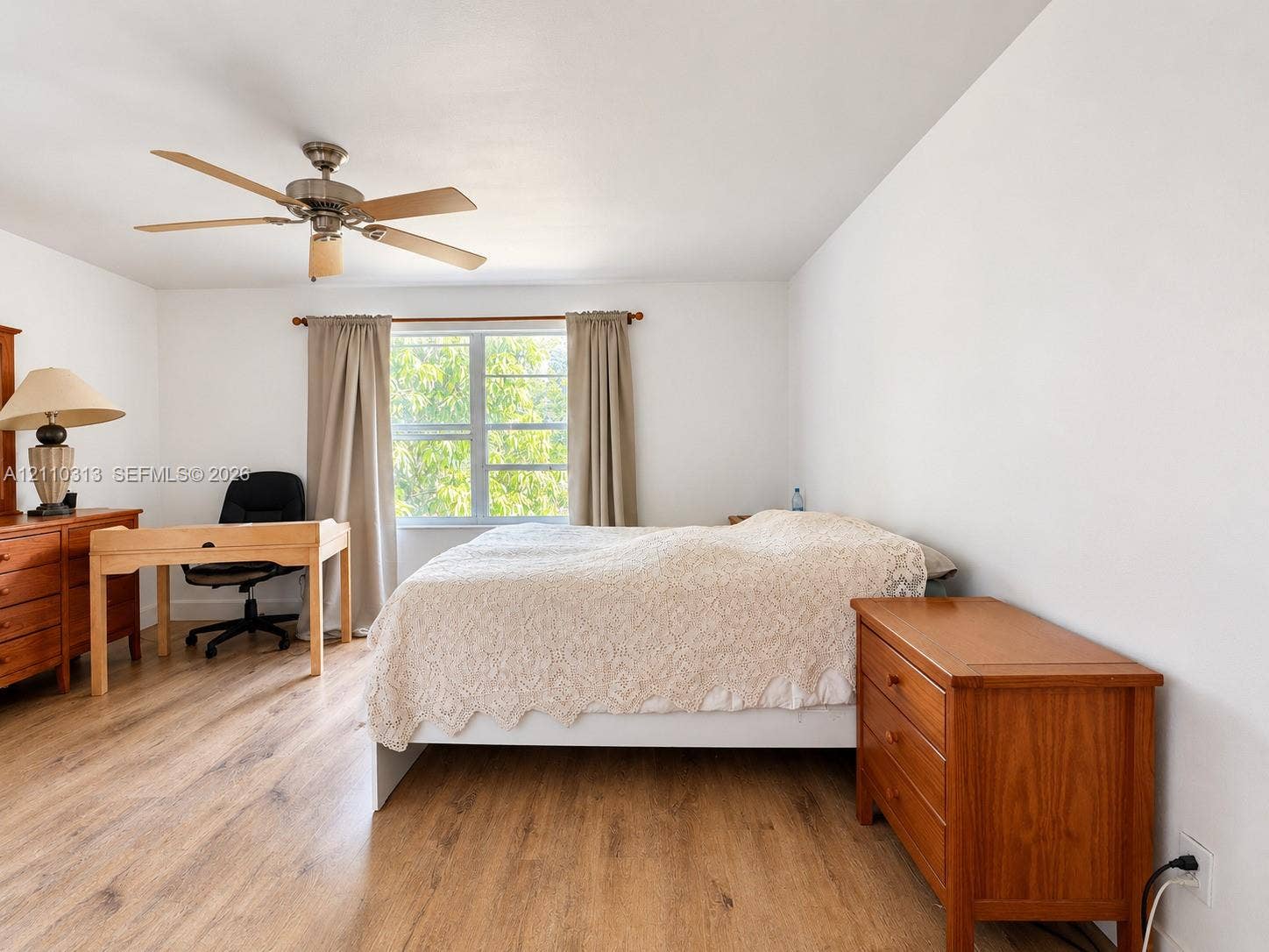 17731 SW 23rd Street, Miramar, FL 33029 Wood-finish flooring, multi-pane window, and integrated ceiling fan