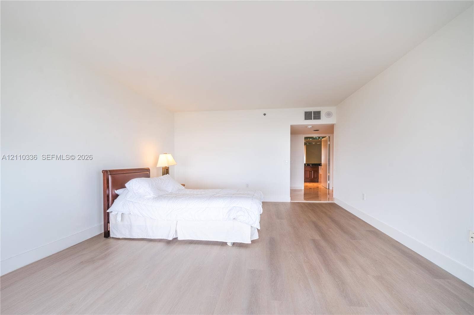 16445 Collins Avenue, #WS-7B, Sunny Isles Beach, Sunny Isles Beach, FL 33160 Expansive room featuring light-toned wood-finish flooring, smooth white walls, and high ceilings