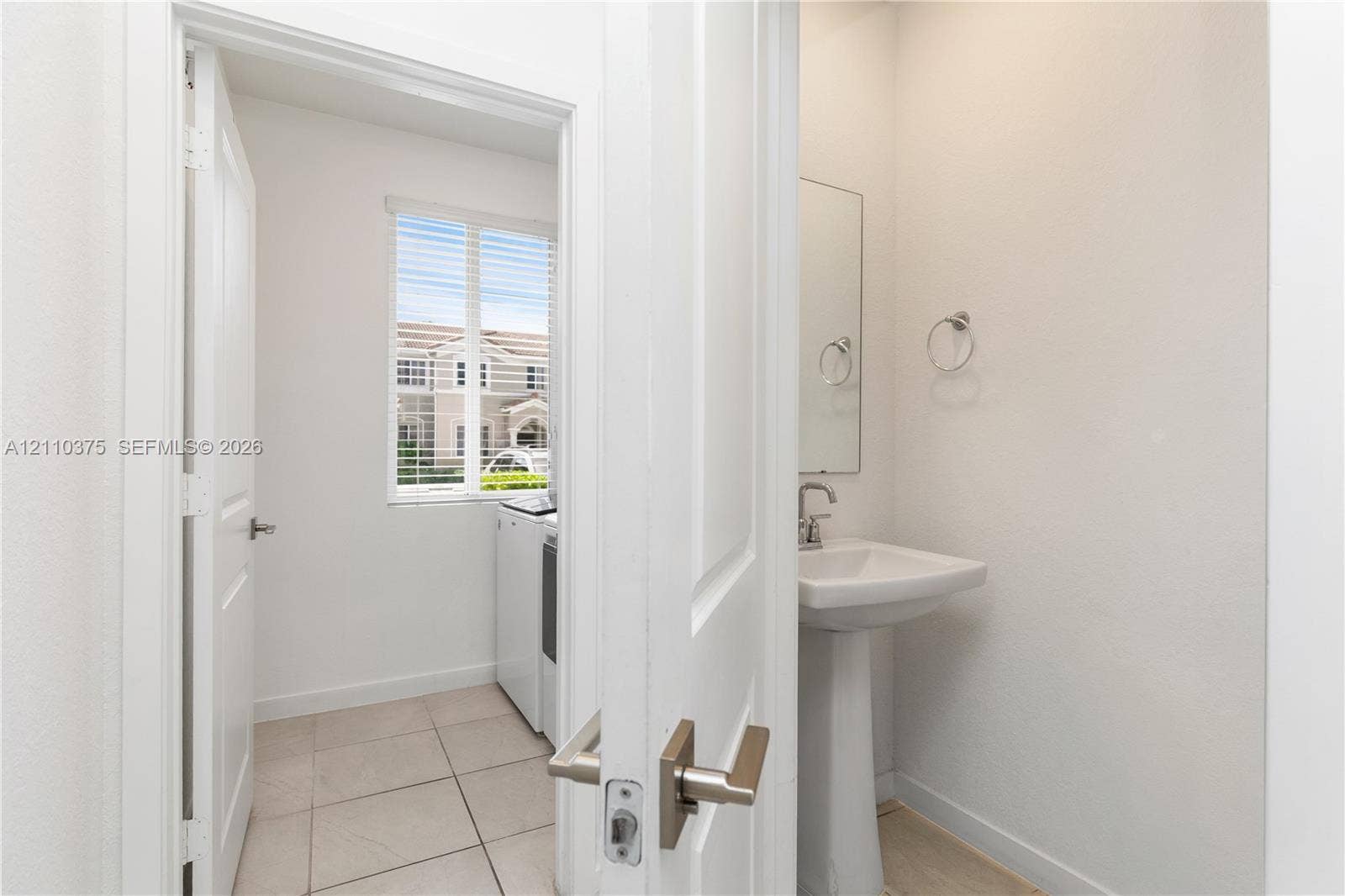 1051 SE 23rd Terrace, Homestead, FL 33035 1st Floor Entrance to Half bathroom and Laundry Room