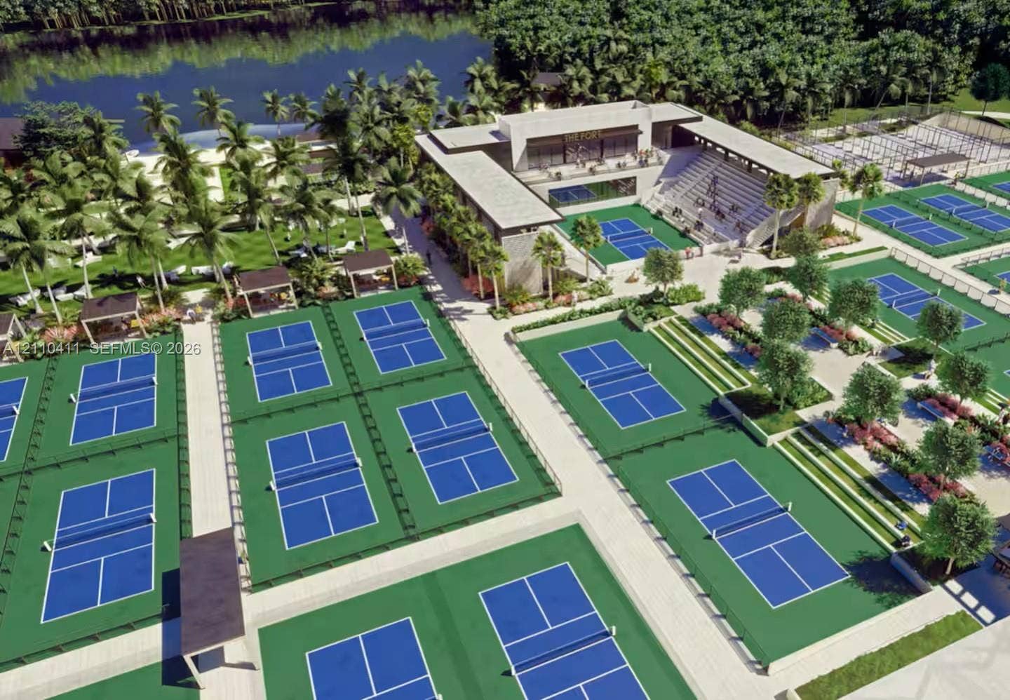 Extensive recreation facility featuring multiple sports courts, tiered stadium seating, integrated landscaping, and proximity to waterfront grounds
