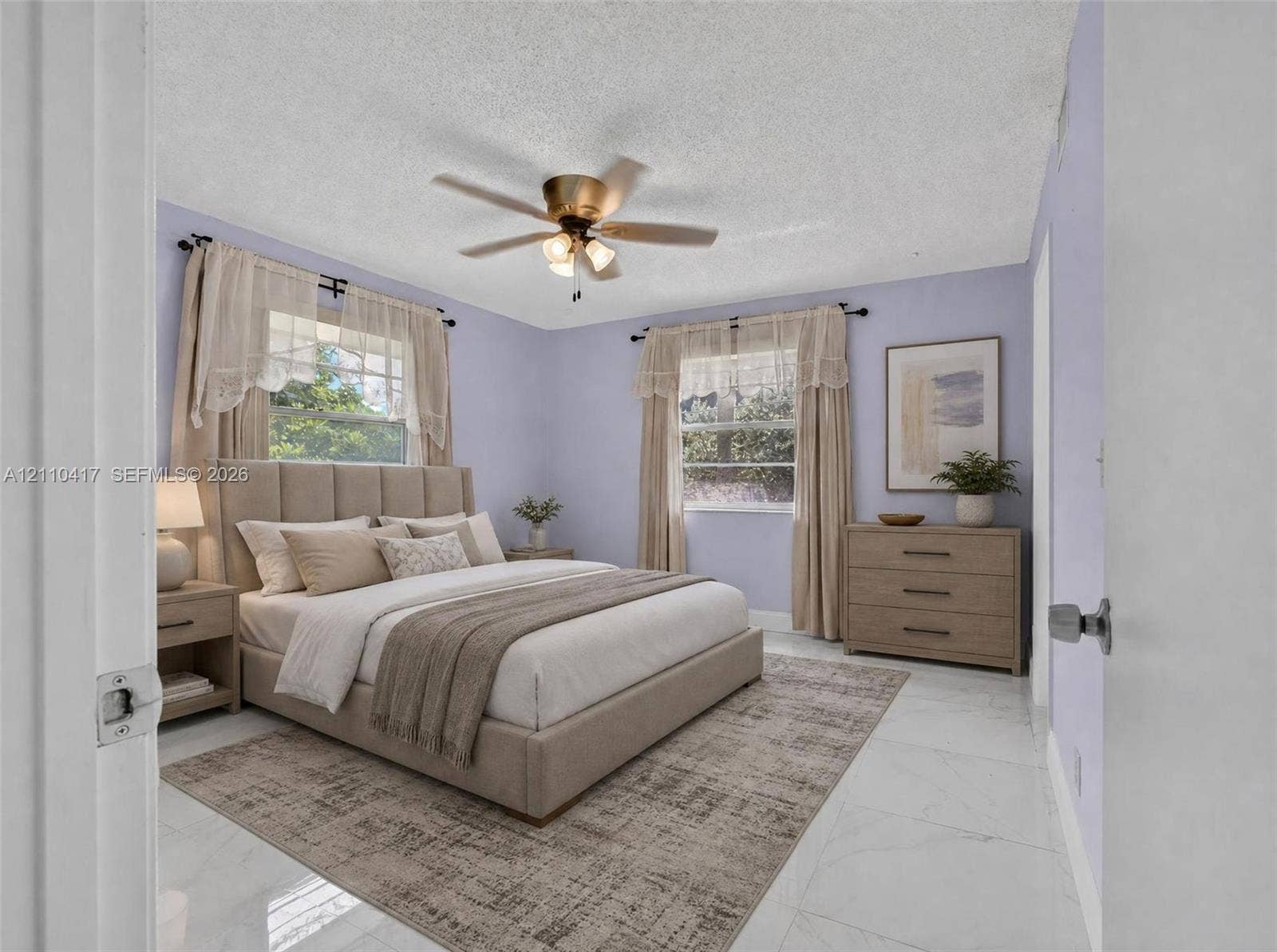 2369 NW 89th Drive, #514, Coral Springs, FL 33065 Bedroom featuring polished stone-finish flooring and a central ceiling fan with integrated lighting