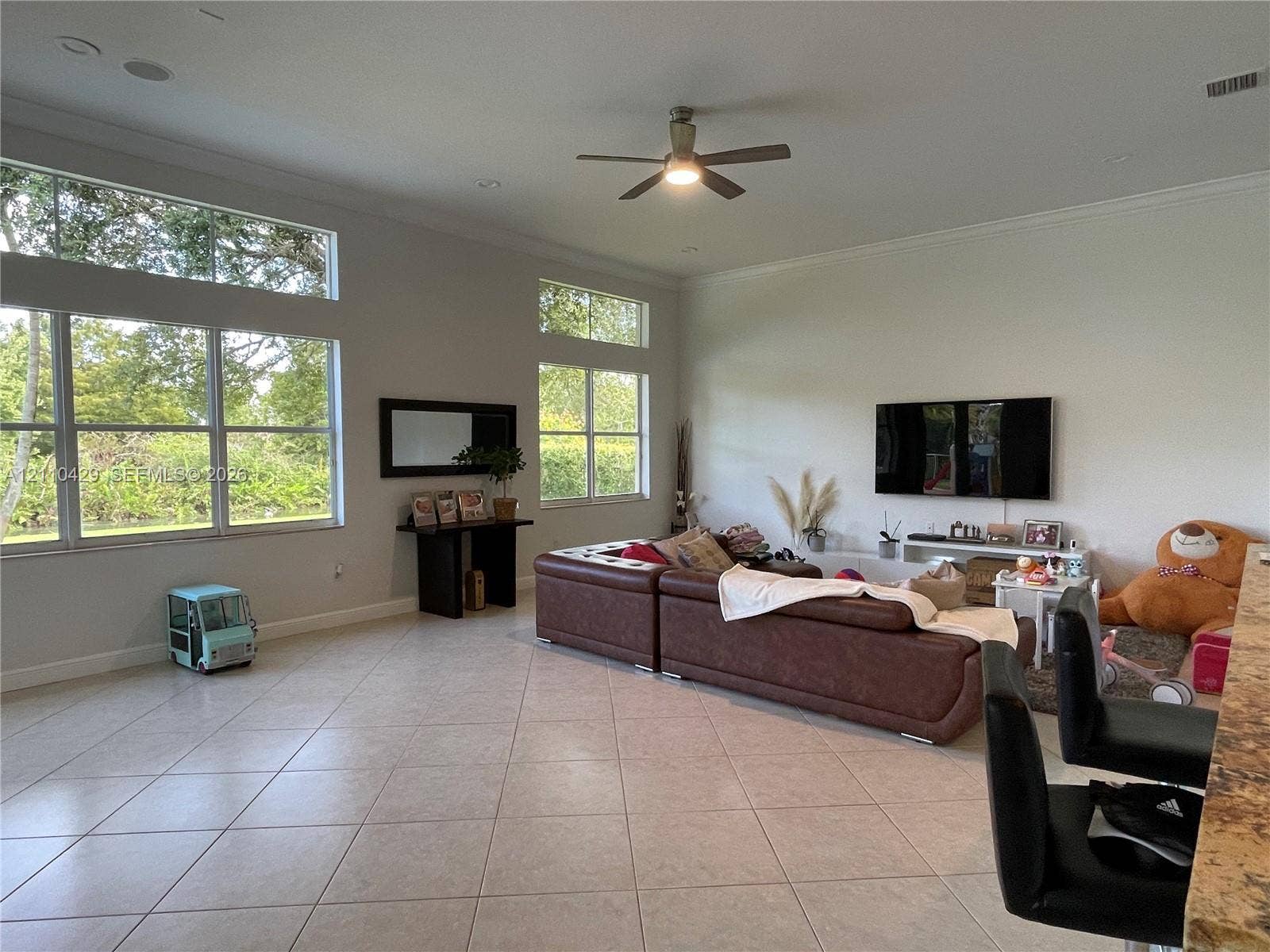 15001 SW 33rd Street, Davie, Davie, FL 33331 Living area featuring tile flooring, oversized windows with transom glass, recessed lighting, and a ceiling fan
